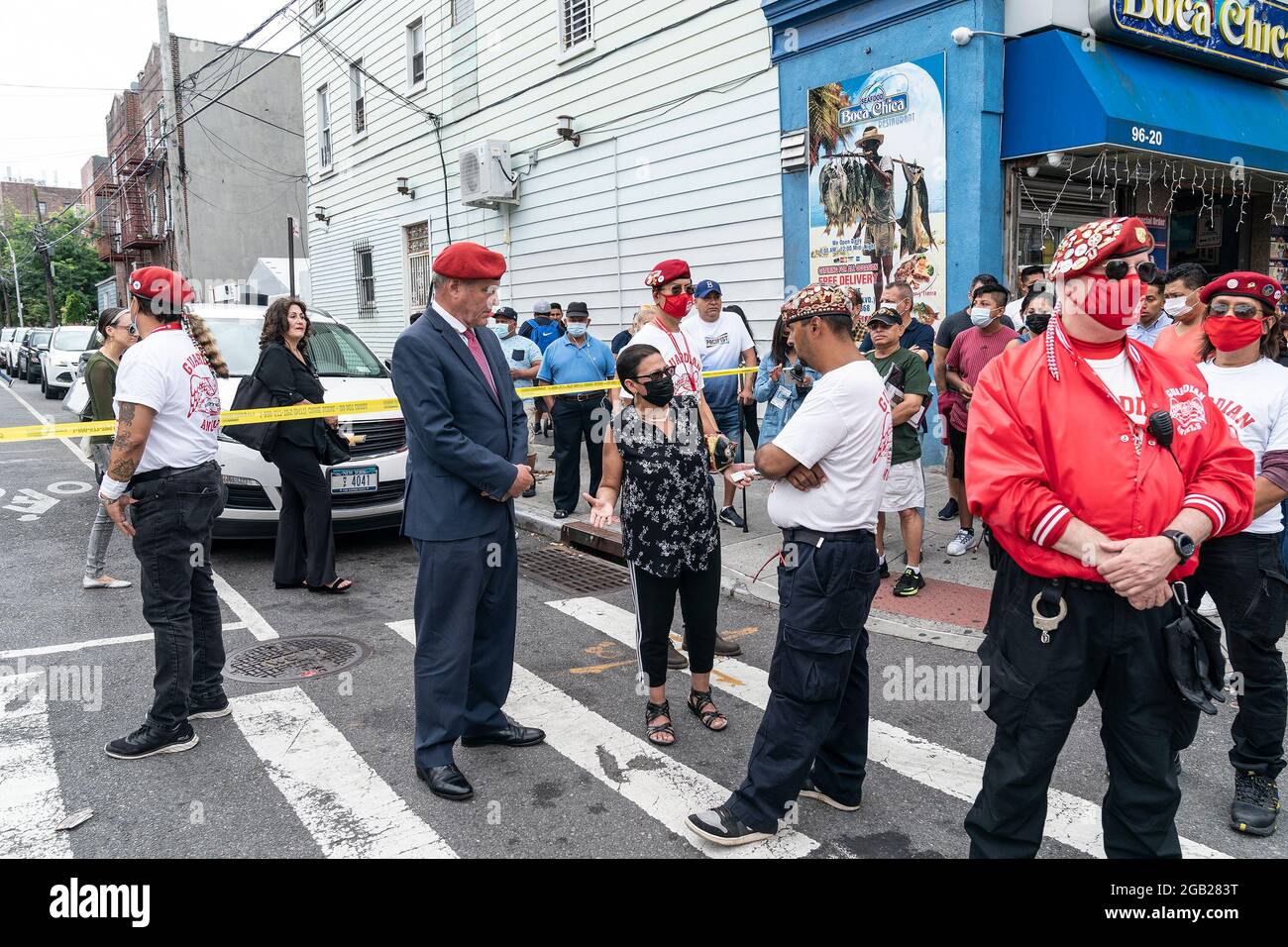 Republican Party Mayoral candidate Curtis Sliwa speaks with Maya (C) whose  son was killed 30 years ago on 37th Avenue in Queens the same location  where 10 people were shot the night