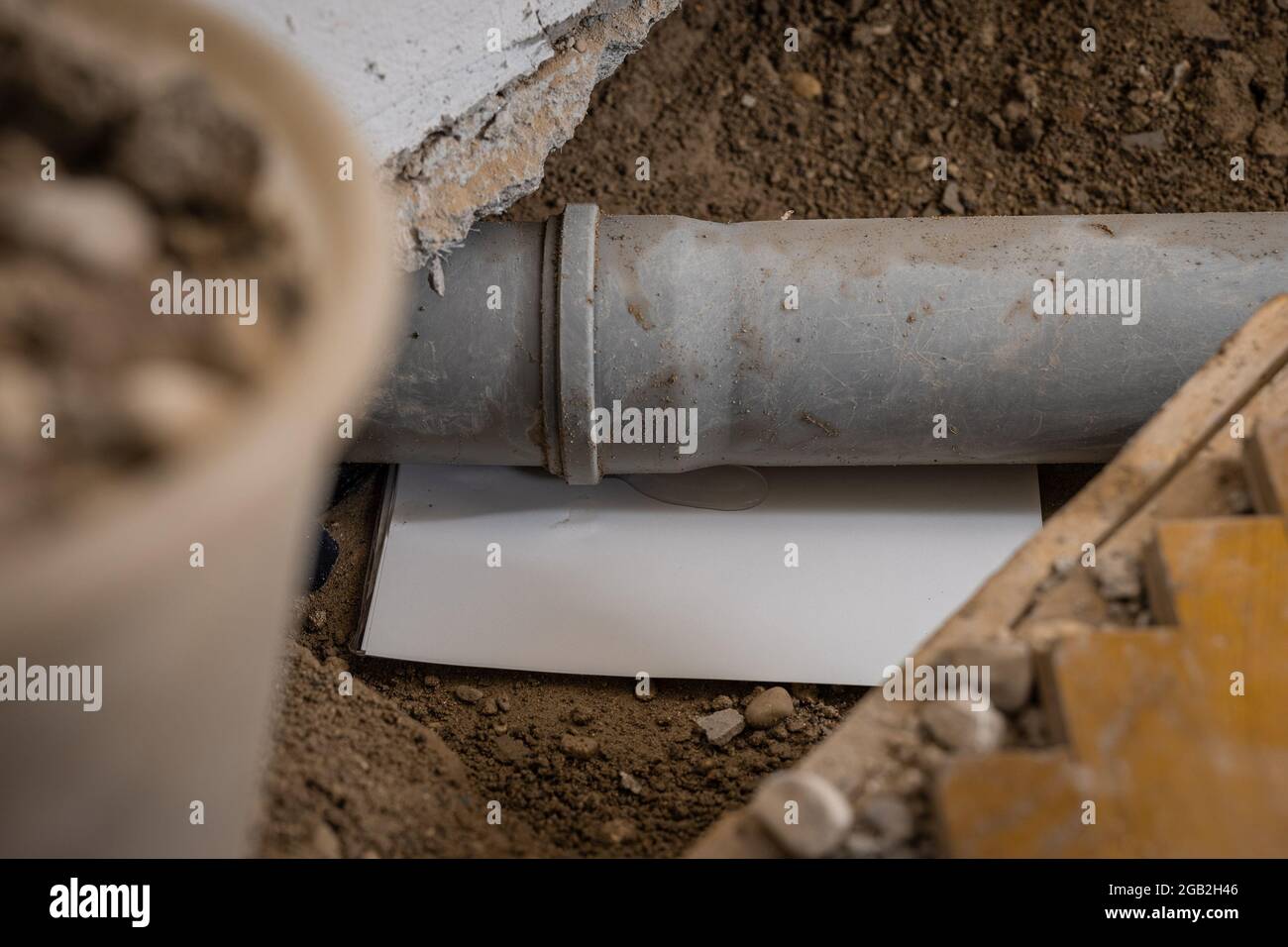 Drainage sewer pipe in the ground with paper to find out where is the