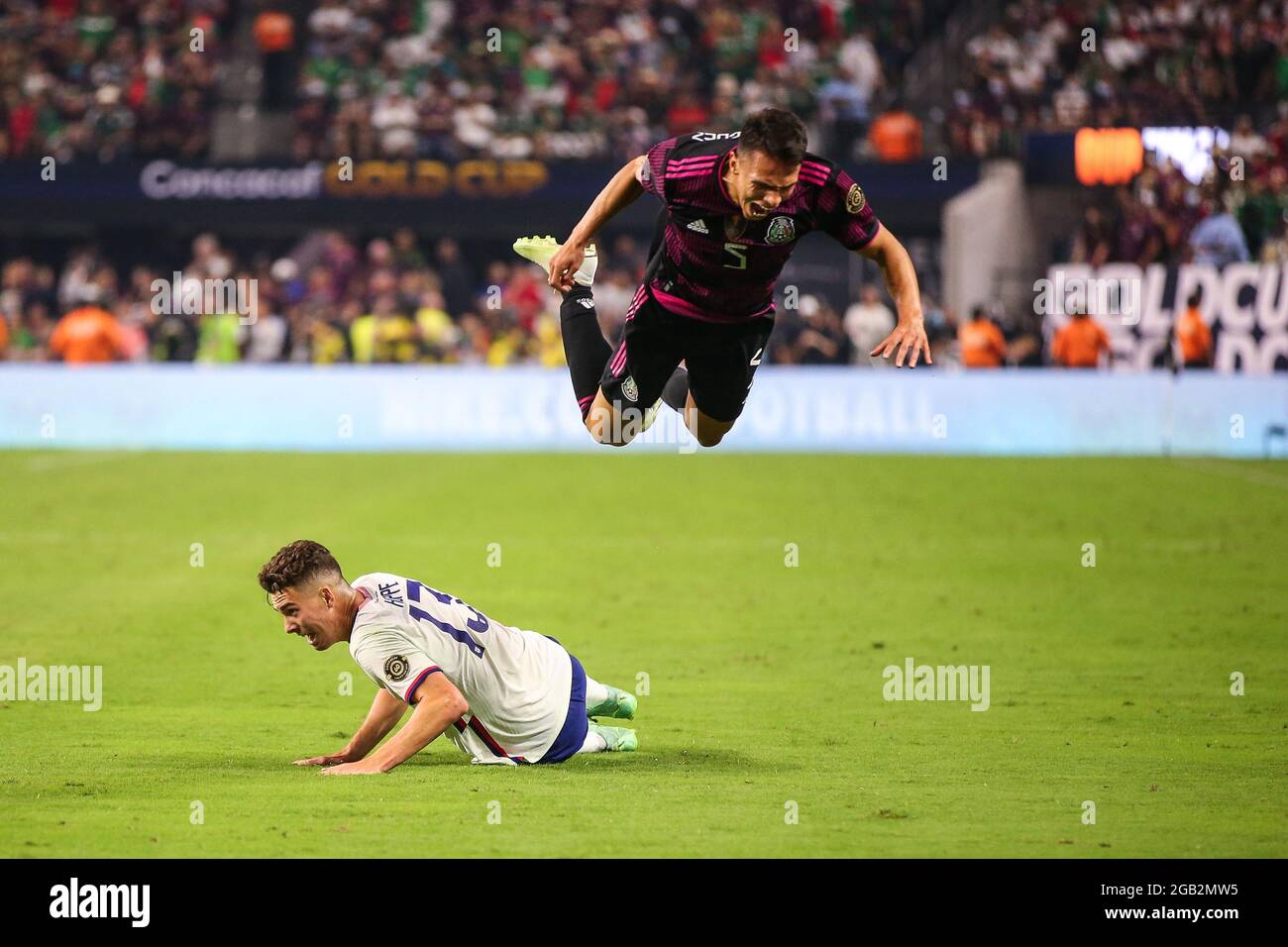 August 1, 2021: Mexico defender Osvaldo Rodríguez (5) leaps over United States forward Matthew Hoppe during the CONCACAF Gold Cup 2021 Final featuring the United States and Mexico at Allegiant Stadium in Las Vegas, NV. The United States defeated Mexico in extra-time 1-0. Christopher Trim/CSM. Stock Photo