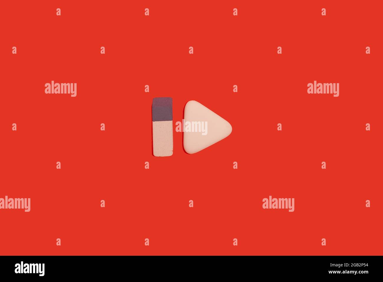 two erasers on a red background. office accessories Stock Photo