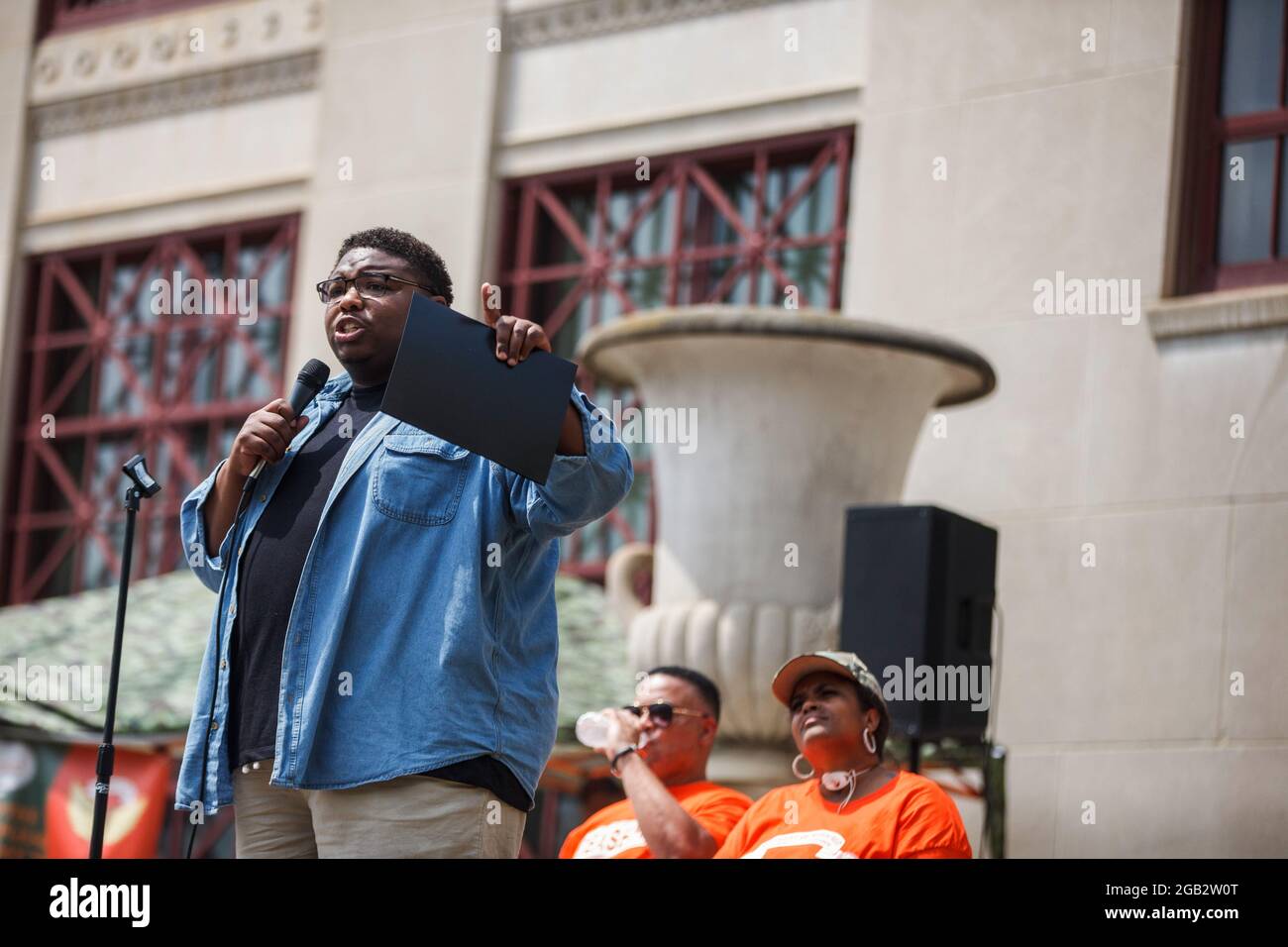Dontavius Jarrells, a current Democratic member of the Ohio House of Representatives representing the 25th district of Ohio, brings attention to House Bill 374 while talking at a rally against violence at Columbus City Hall with organizers Malissa Thomas-St. Clair and Al Edmondson sitting behind him. In reaction to the rising violence since 2020 Malissa Thomas-St. Clair, a mother of a murdered son, Anthony Thomas-St. Clair, founded Mothers of Murdered Columbus Children (MOMCC), an anti-violence group seeking to end violent crime in Columbus, Ohio. MOMCC led the effort for a Central Ohio Anti-V Stock Photo