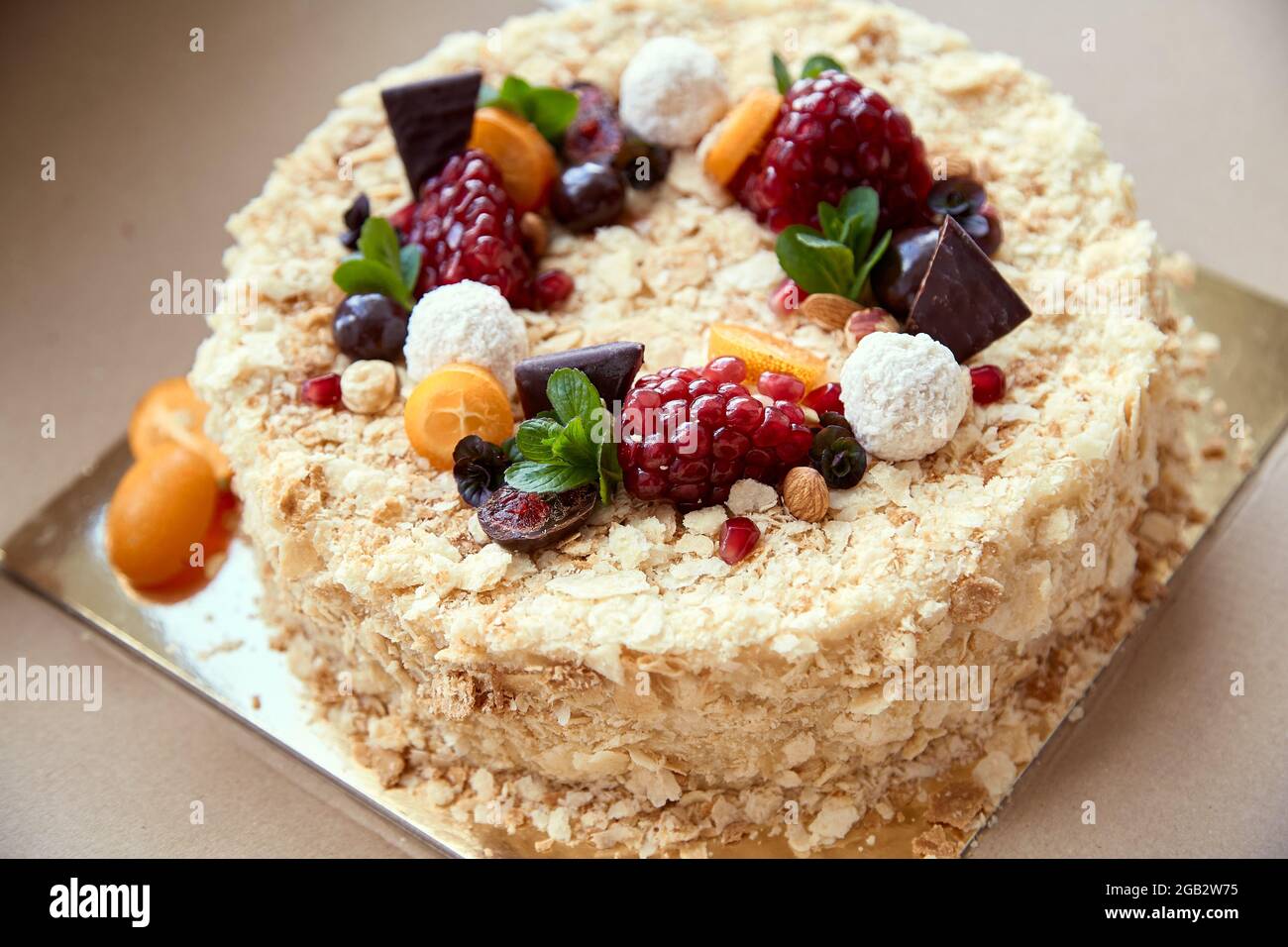 Birthday cake. Garnished with fruits, berries and chocolate. Festive mood. High quality photo Stock Photo