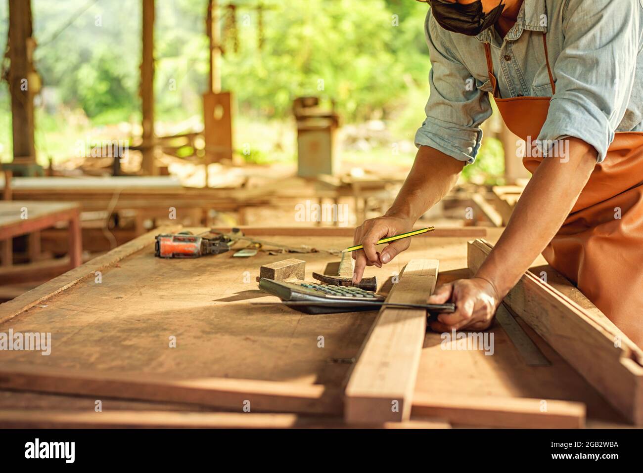 Carpenter Woodwork and furniture making in carpentry workshop