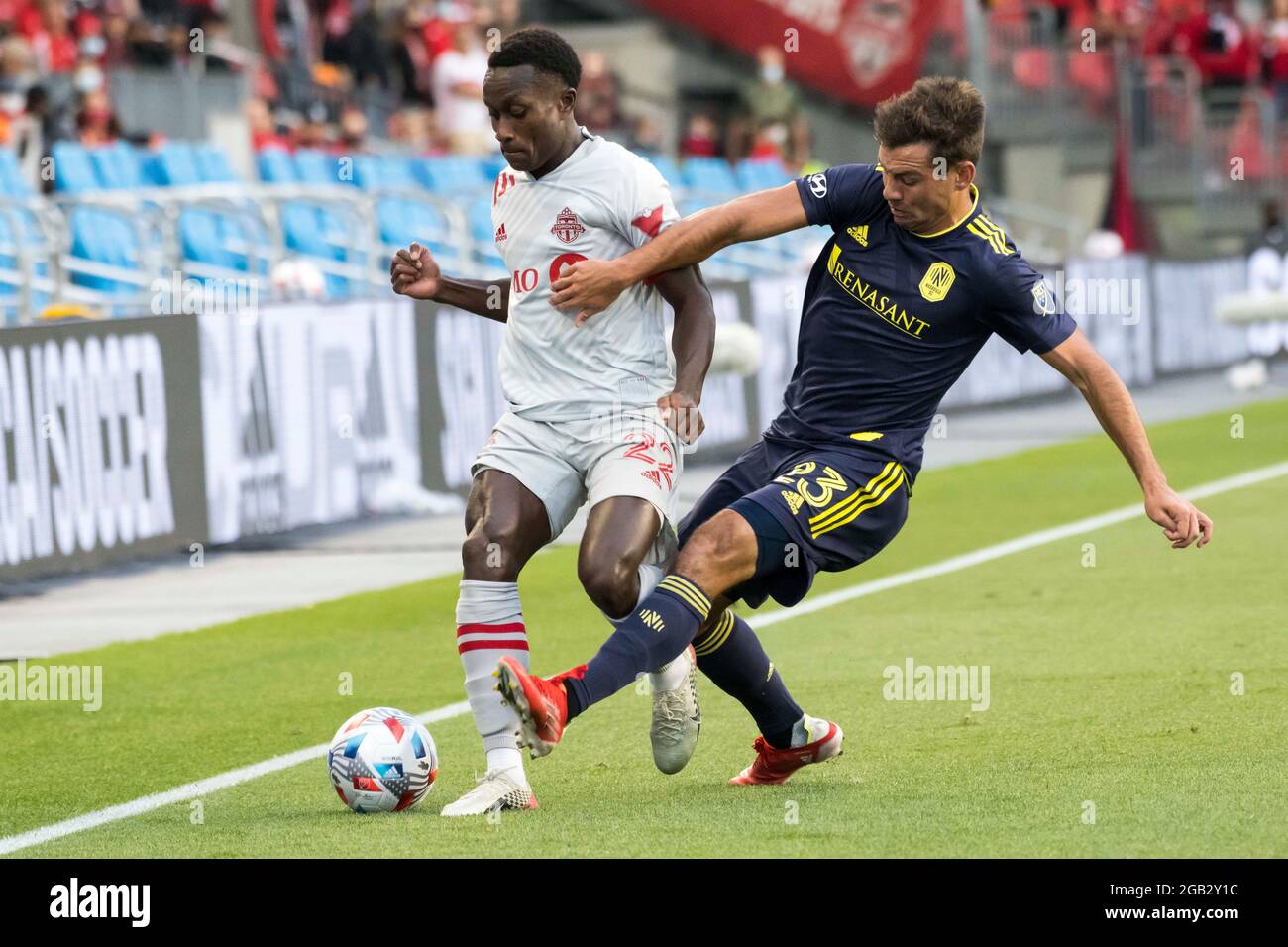 Toronto, Ontario, Canada. 1st Aug, 2021. Richie Laryea (22) and Taylor Washington (23) in action during the MLS game between between Toronto FC and Nashville SC. The game ended 1-1 (Credit Image: © Angel Marchini/ZUMA Press Wire) Stock Photo