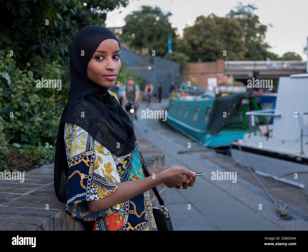 Portrait of a Muslim woman on a towpath along the Regent's Canal at King's Cross in London. Stock Photo