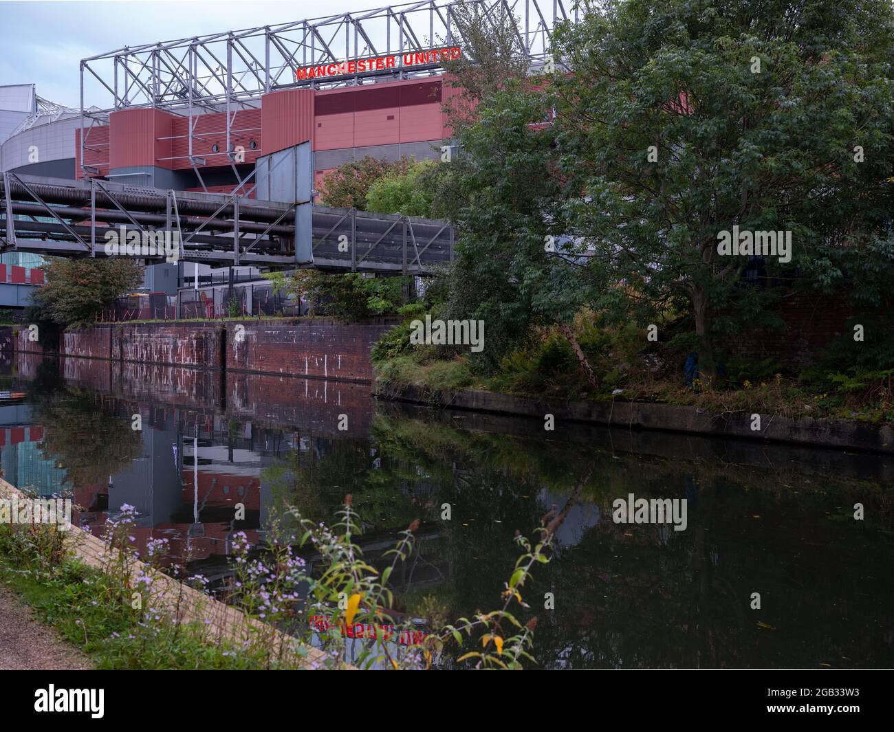 Old Trafford Stadium, home of Manchester United. View from the Bridgwater Canal Stock Photo