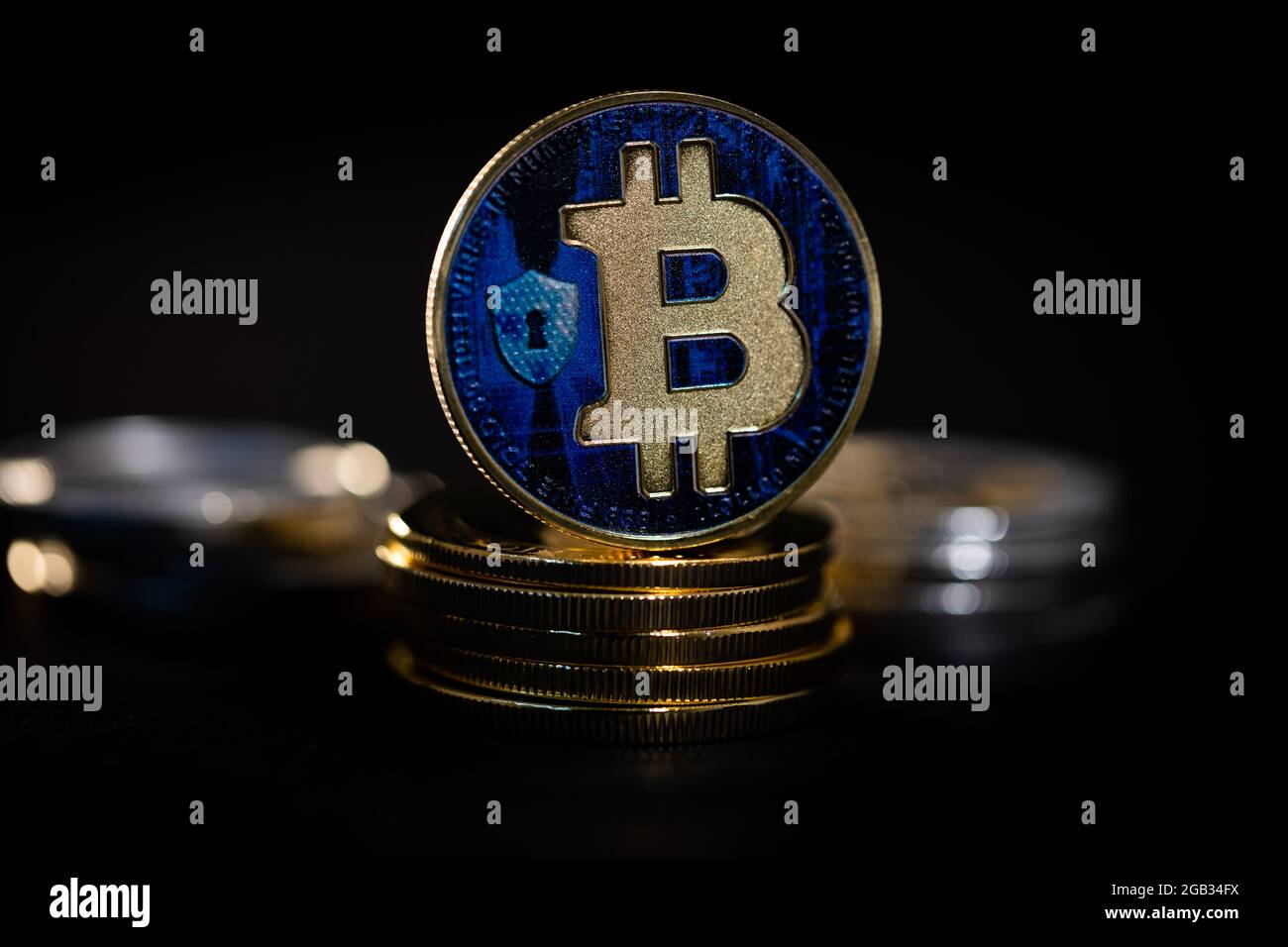 Bitcoin tokens amongst other cryptocurrency coins Stock Photo