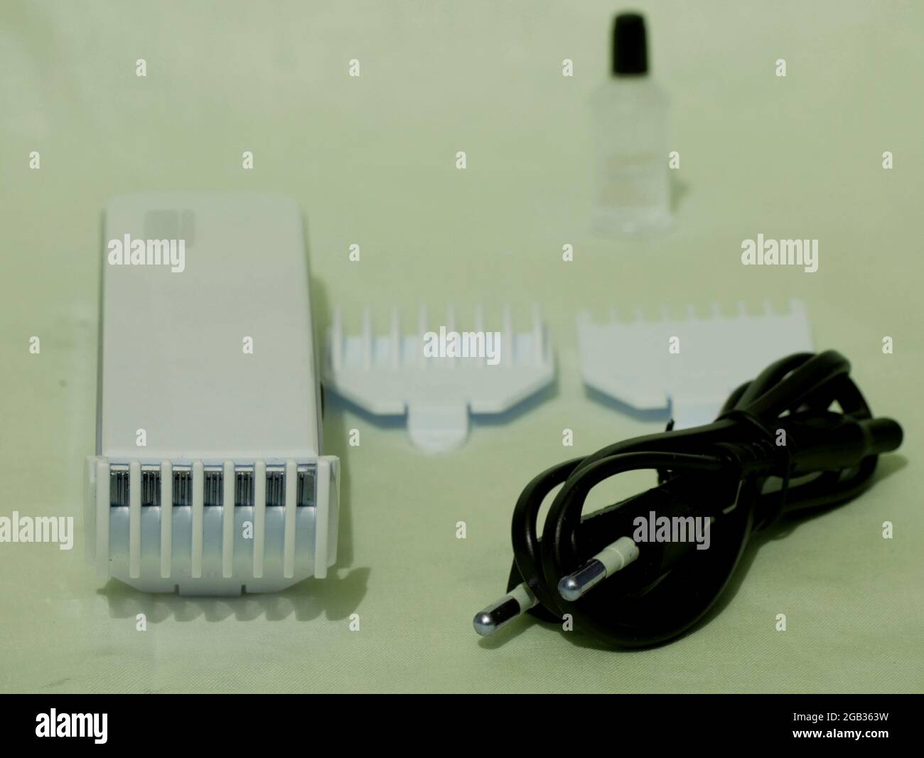 Electronic shaving trimming tool equipment kit presented on white background. Stock Photo