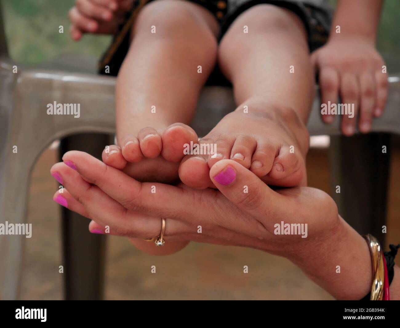 https://c8.alamy.com/comp/2GB394K/little-kid-feet-kept-on-female-hand-caring-concept-presented-with-boy-foot-2GB394K.jpg