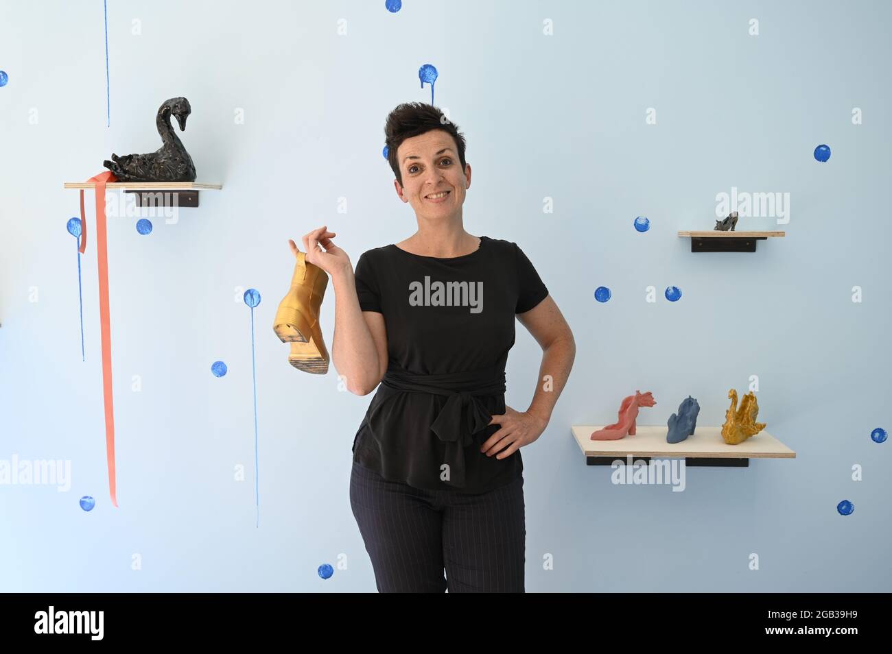 French artist Cécile Meynier at her exhibition 'Sur quel pied danser'  shown at the Besançon gallery Les 2 portes., shoes Stock Photo