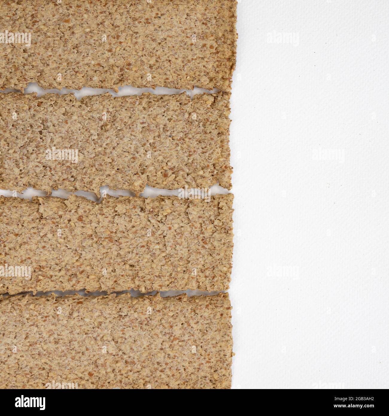 group of light brown multigrain rye crispbreads isolated on white background, bread cracker snacks, top view Stock Photo