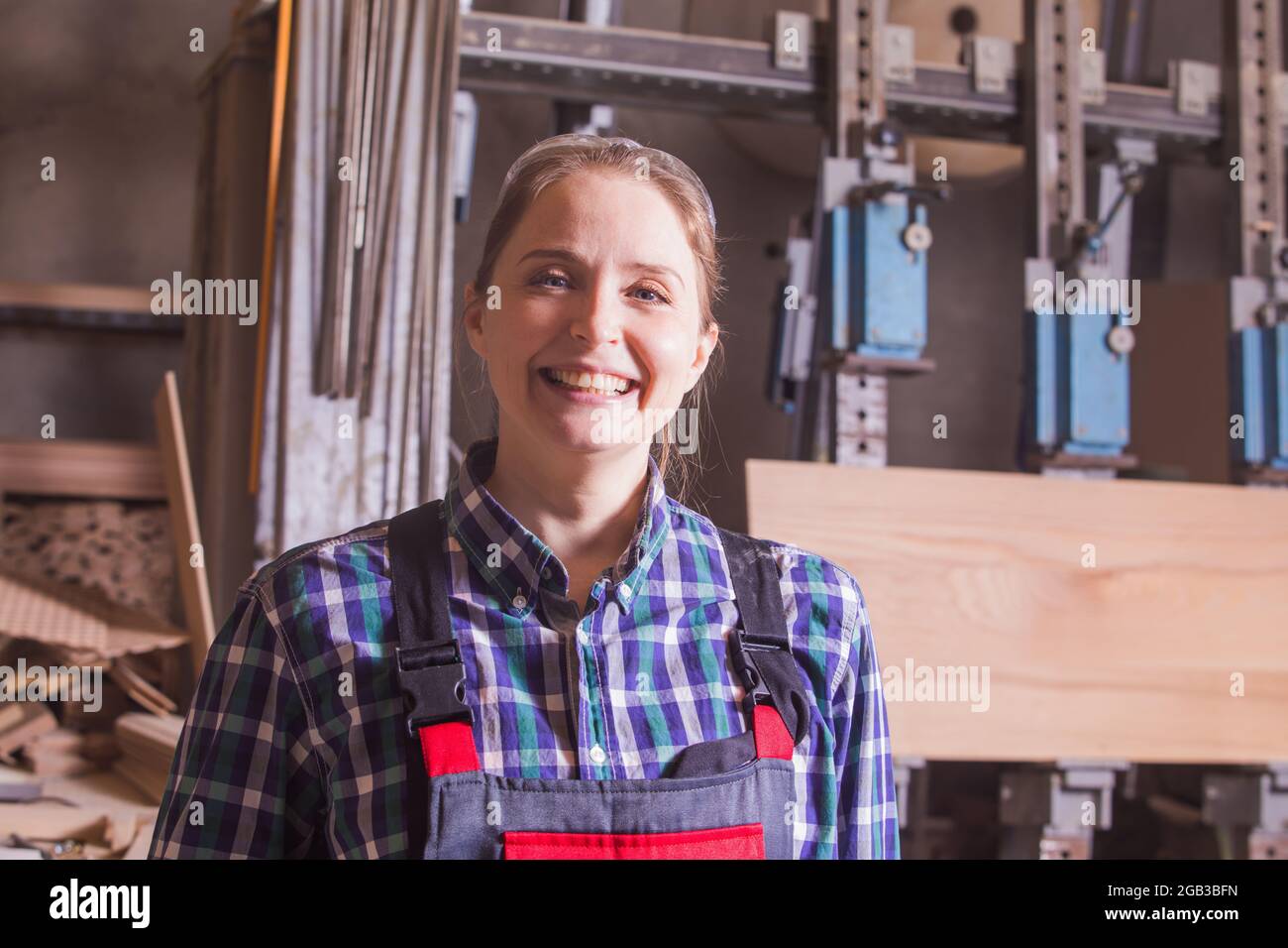 Self-confident woman engineer at woodworking plant indoor Stock Photo ...