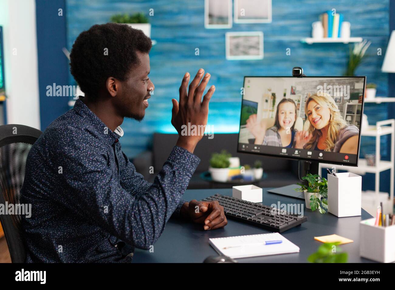 African american man talking on online video call with family and ...