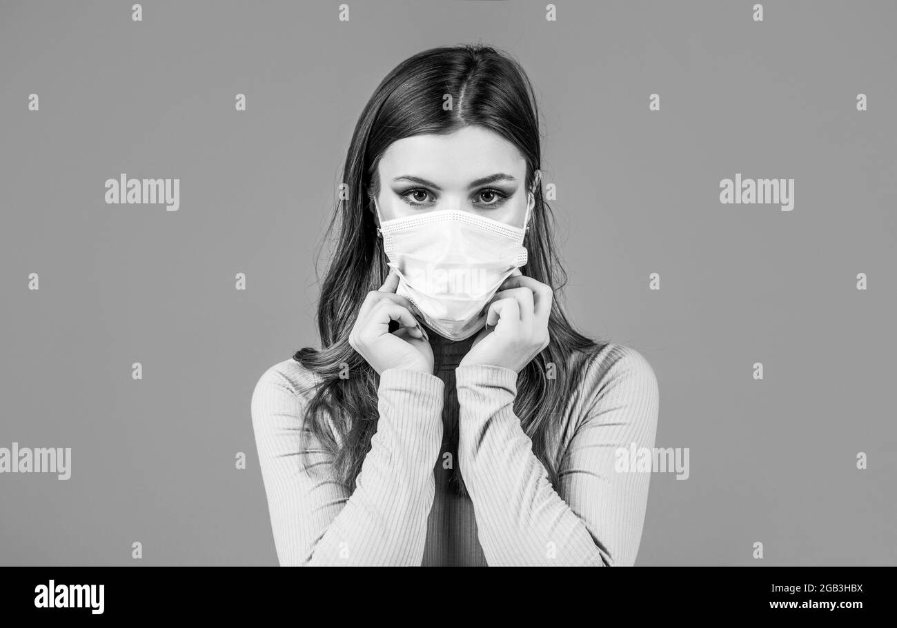 Woman wearing an anti virus protection mask. Woman wearing medical face mask. Black and white