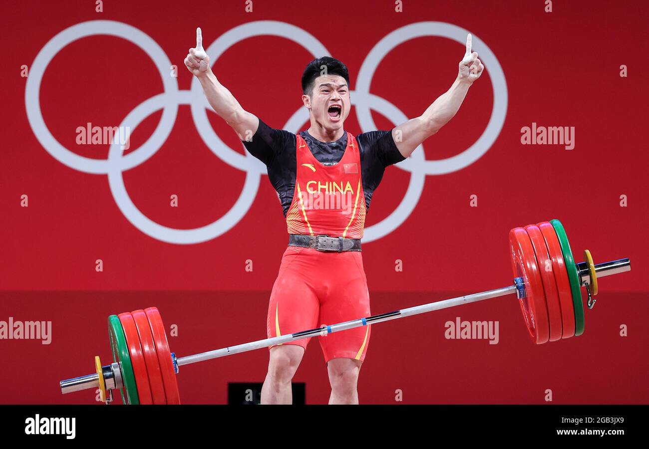 (210802) -- BEIJING, Aug. 2, 2021 (Xinhua) -- Shi Zhiyong of China reacts during the men's 73kg weightlifting event of the Tokyo 2020 Olympic Games in Tokyo, Japan, July 28, 2021. (Xinhua/Yang Lei) Stock Photo