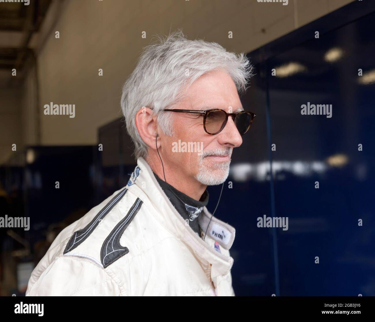 Close-up of Damon Hill OBE, in  Pit Garage 27, at the Silverstone Classic 2021, just before he gave a demonstration of his Championship Winning Williams FW18 Formula One Car Stock Photo