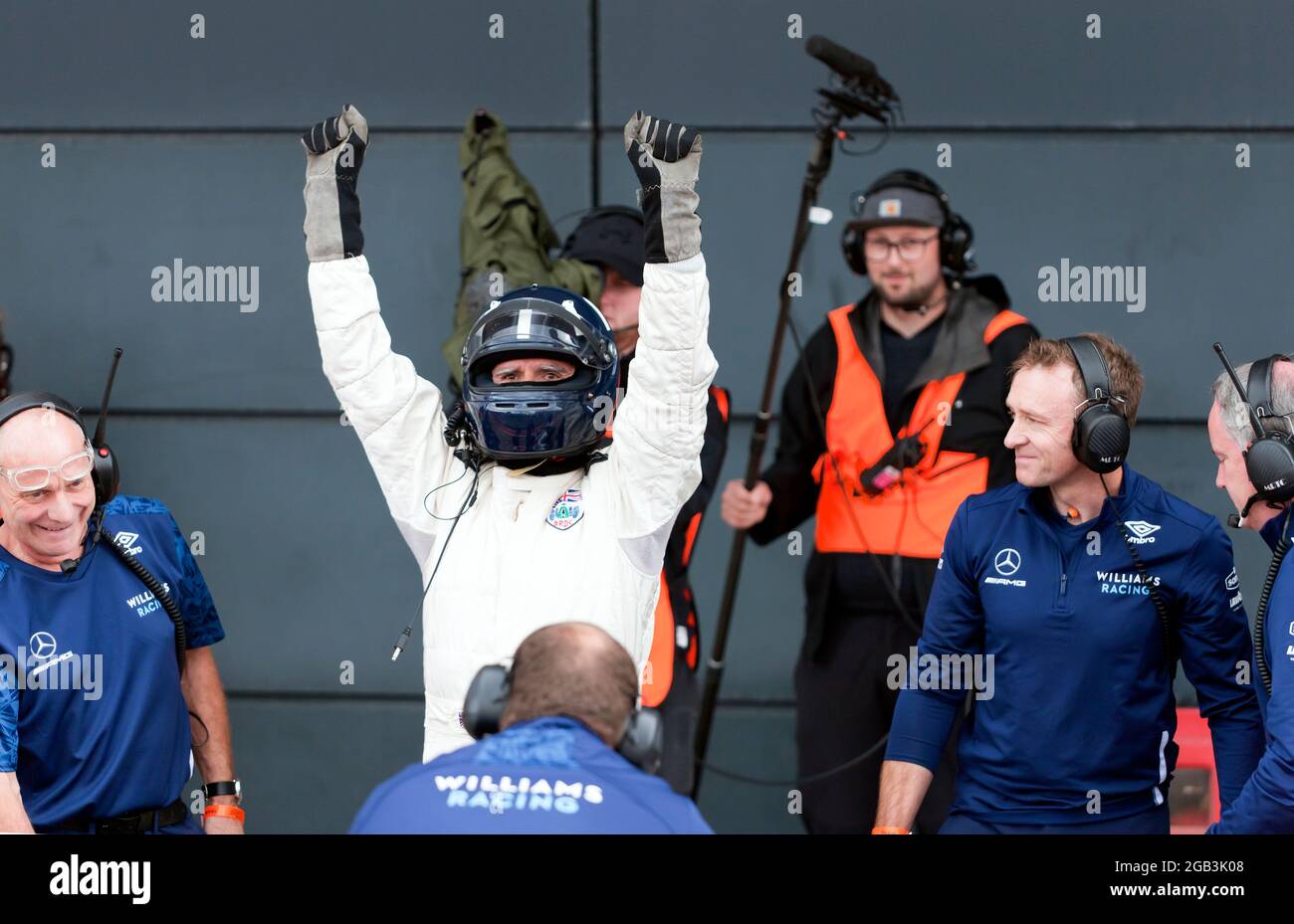 Damon Hill celebrating after performing several high speed demonstration laps in his World Championship winning Williams FW18 Formula One Car, at the Silverstone Classic 2021 Stock Photo