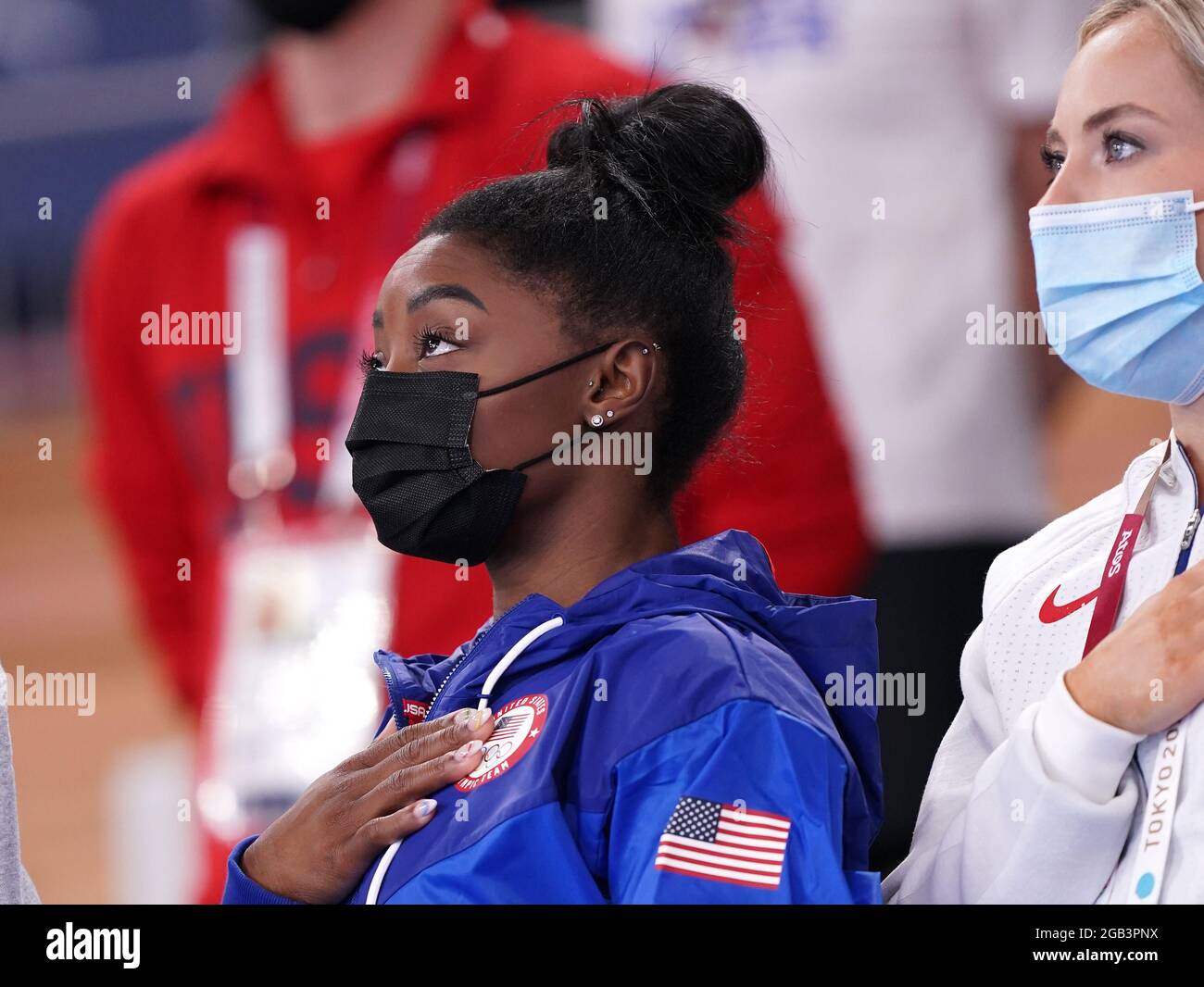 USA's Simone Biles celebrates as her teammate Jade Carey takes gold in