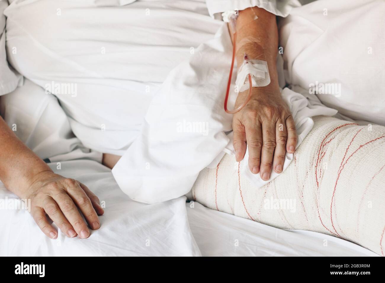 Old woman lying in bed hires stock photography and images Alamy