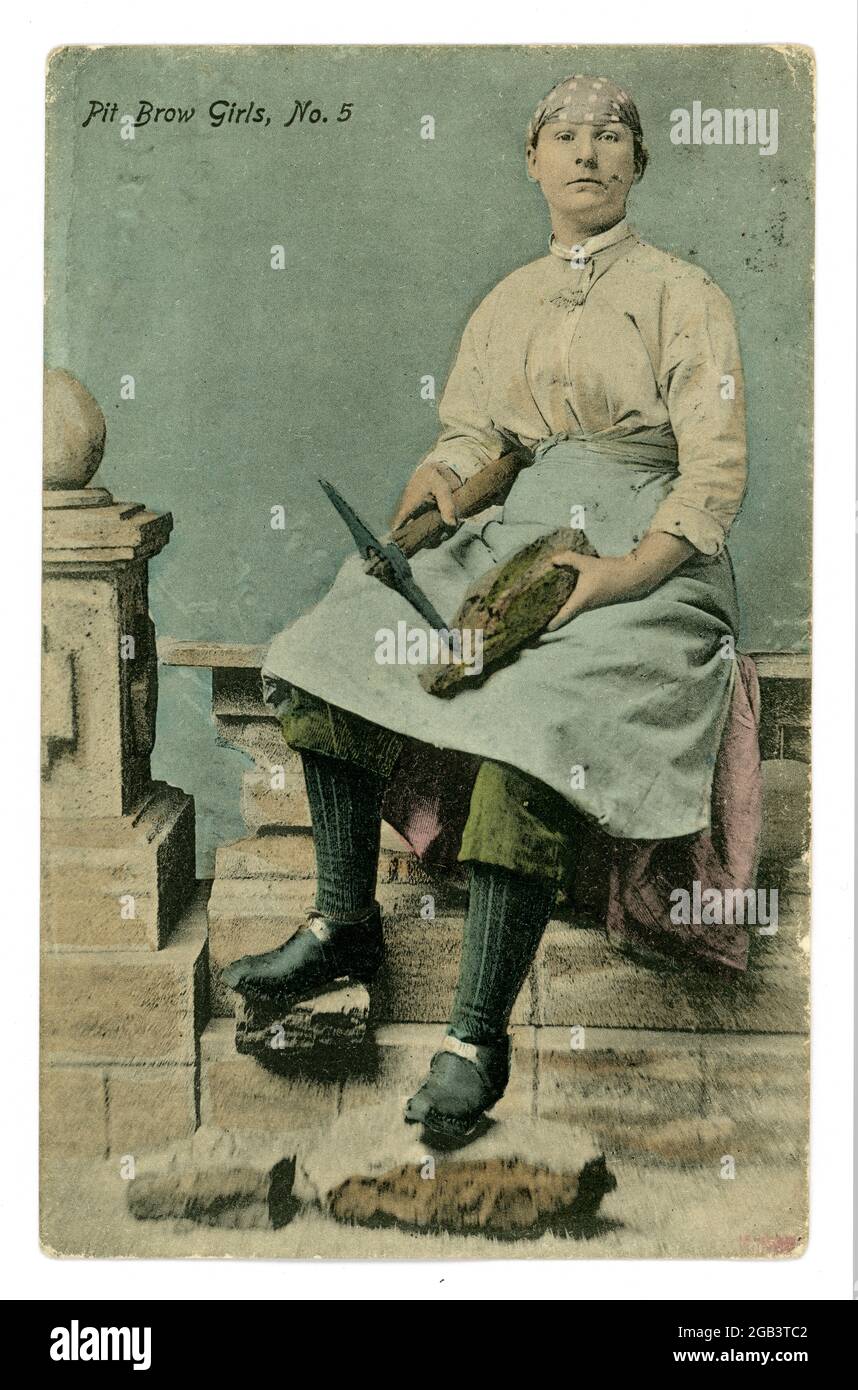 Original early 1900's Edwardian tinted postcard of Pit Brow Girl, holding a pick,  Wigan, Lancashire, U.K. posted 10 August 1905 Stock Photo