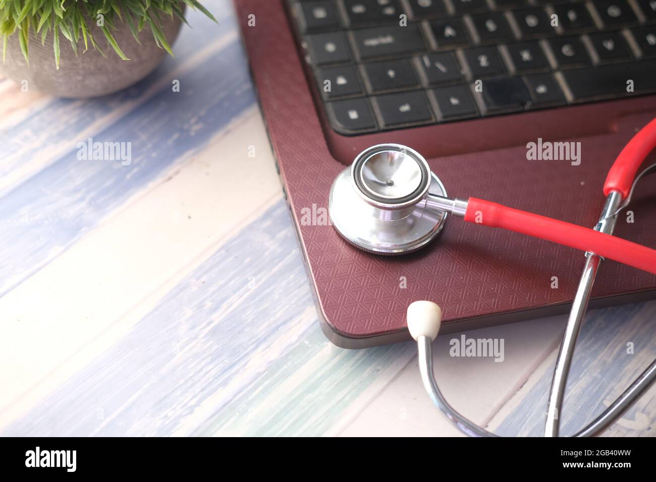 Laptop stethoscope on wooden hi-res stock photography and images - Alamy