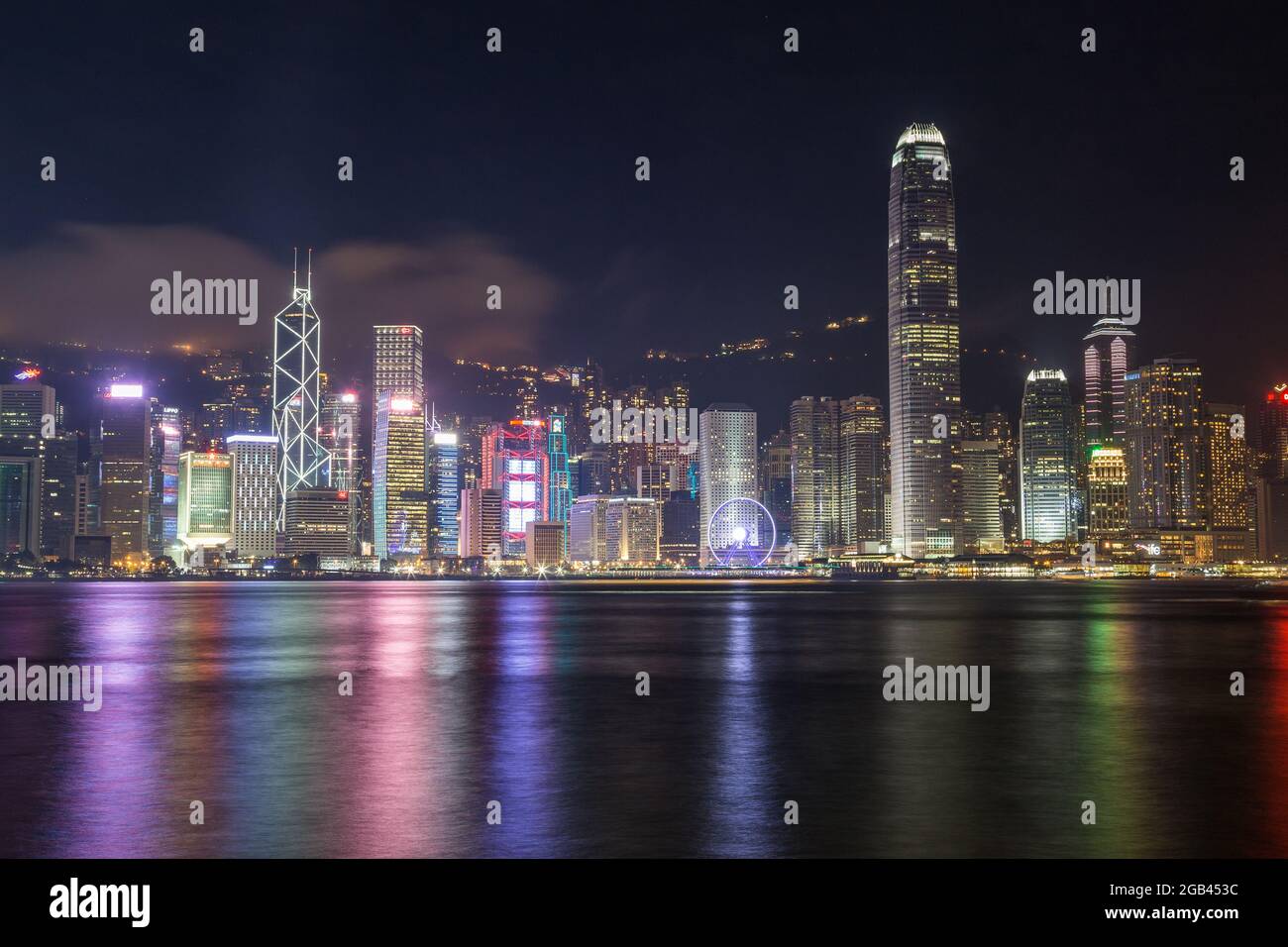HONG KONG - 8TH APRIL 2017: Hong Kong Island skyline at night with views across Victoria Habour. Skyscrapers and office buildings can be seen. Stock Photo