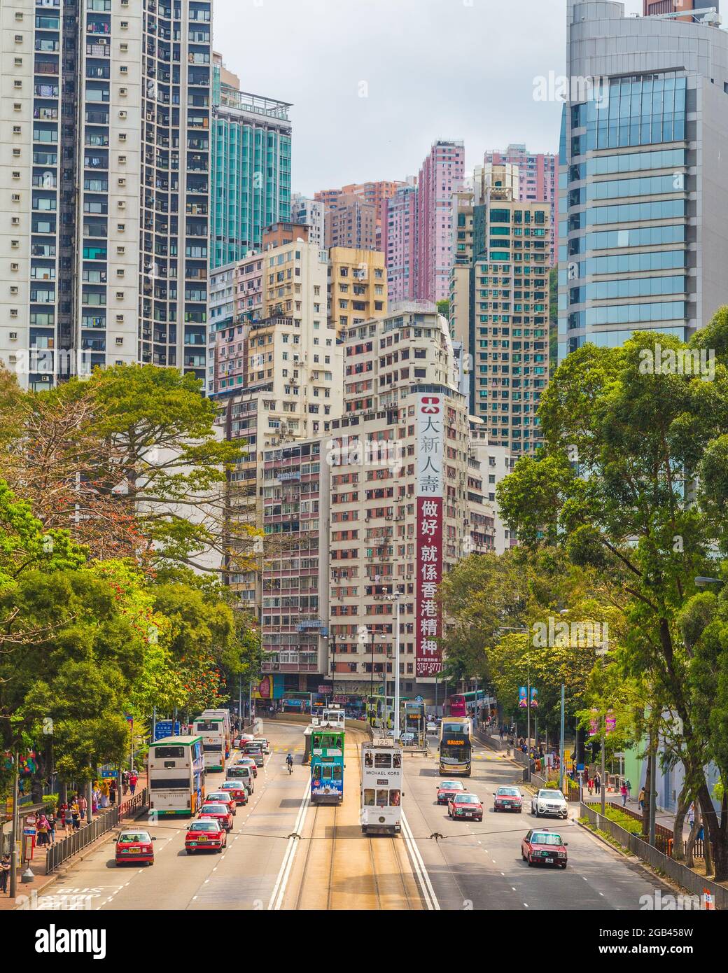 HONG KONG, HONG KONG - 9TH APRIL 2017: Streets of Hong Kong Island during the day. The outside of buildings, cars, buses and people can be seen. Stock Photo