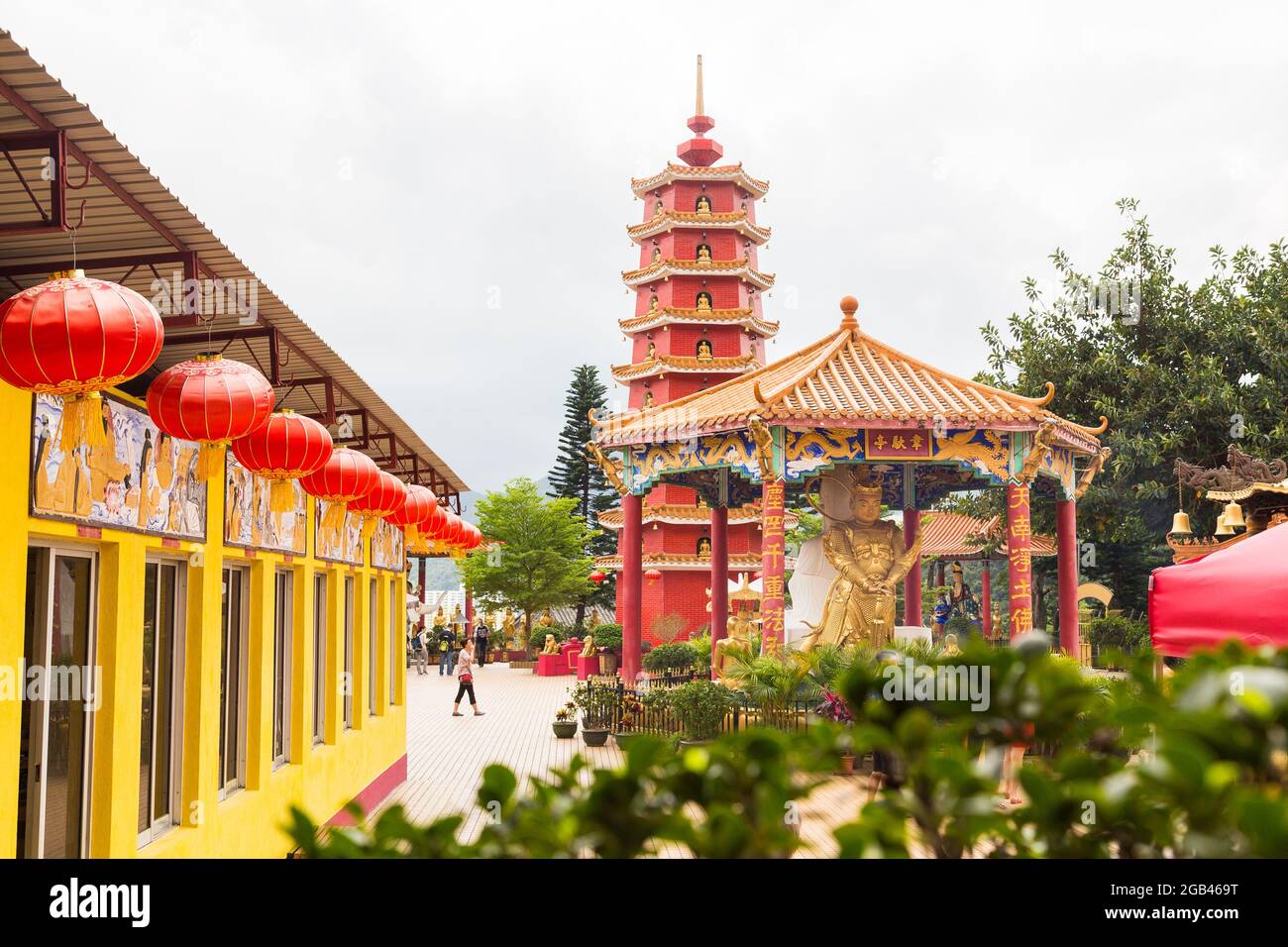 HONG KONG - 10TH APRIL, 2017: Temples and buddhas at Ten Thousand Buddhas Monastery, located in Sha Tin, Hong Kong. People can be seen Stock Photo