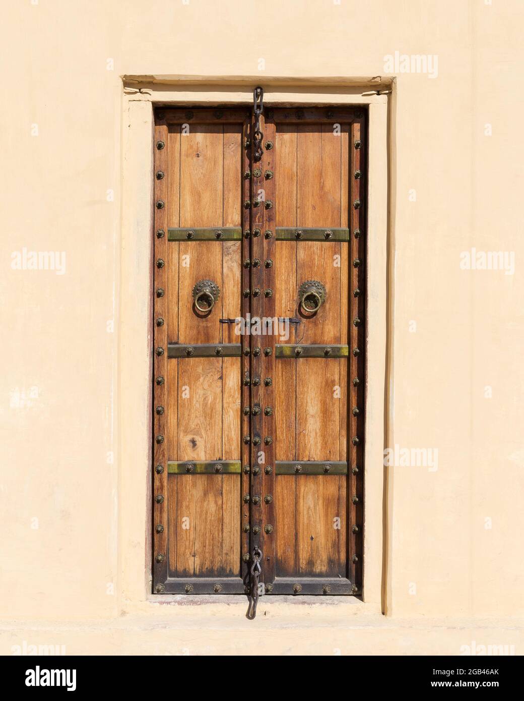 Old Wooden Door in India with metal pins. Stock Photo