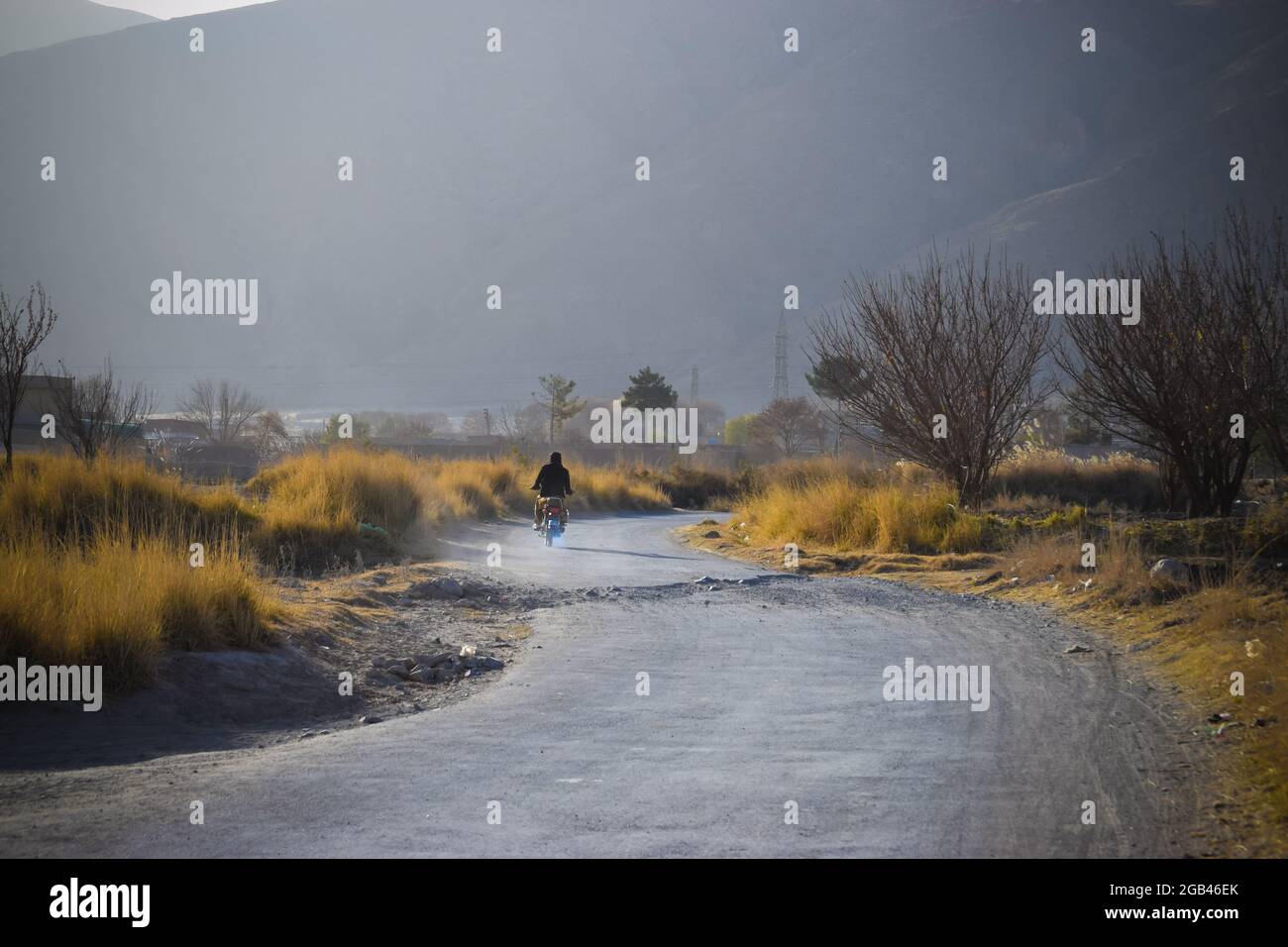 Colorful sky landscape outdoors view of mountains trees bushes evening. spring season nature scenery travel environment Quetta Baluchistan Pakistan Stock Photo