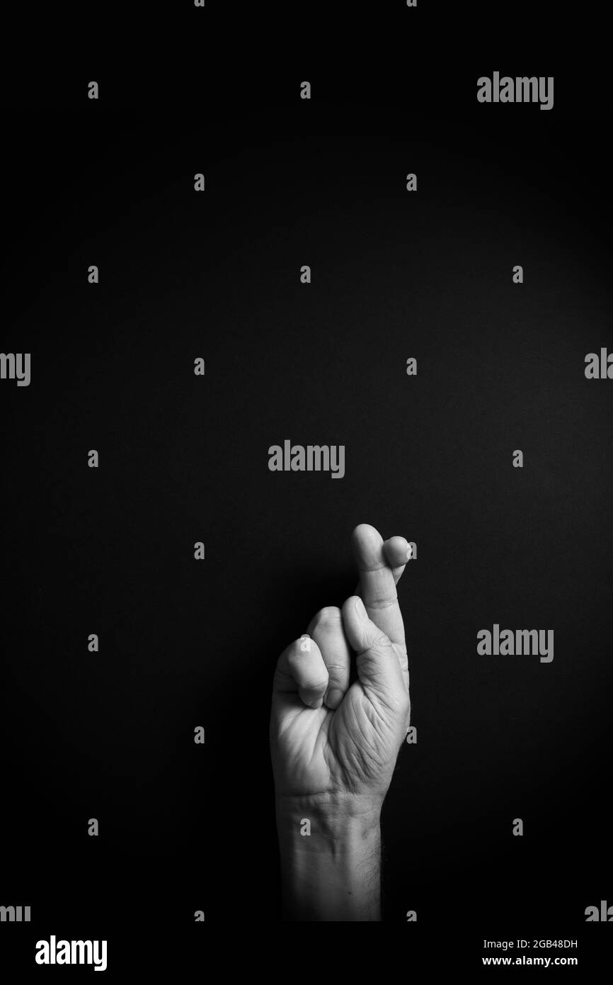 Dramatic B&W image of male hand demonstrating ASL American sign ...