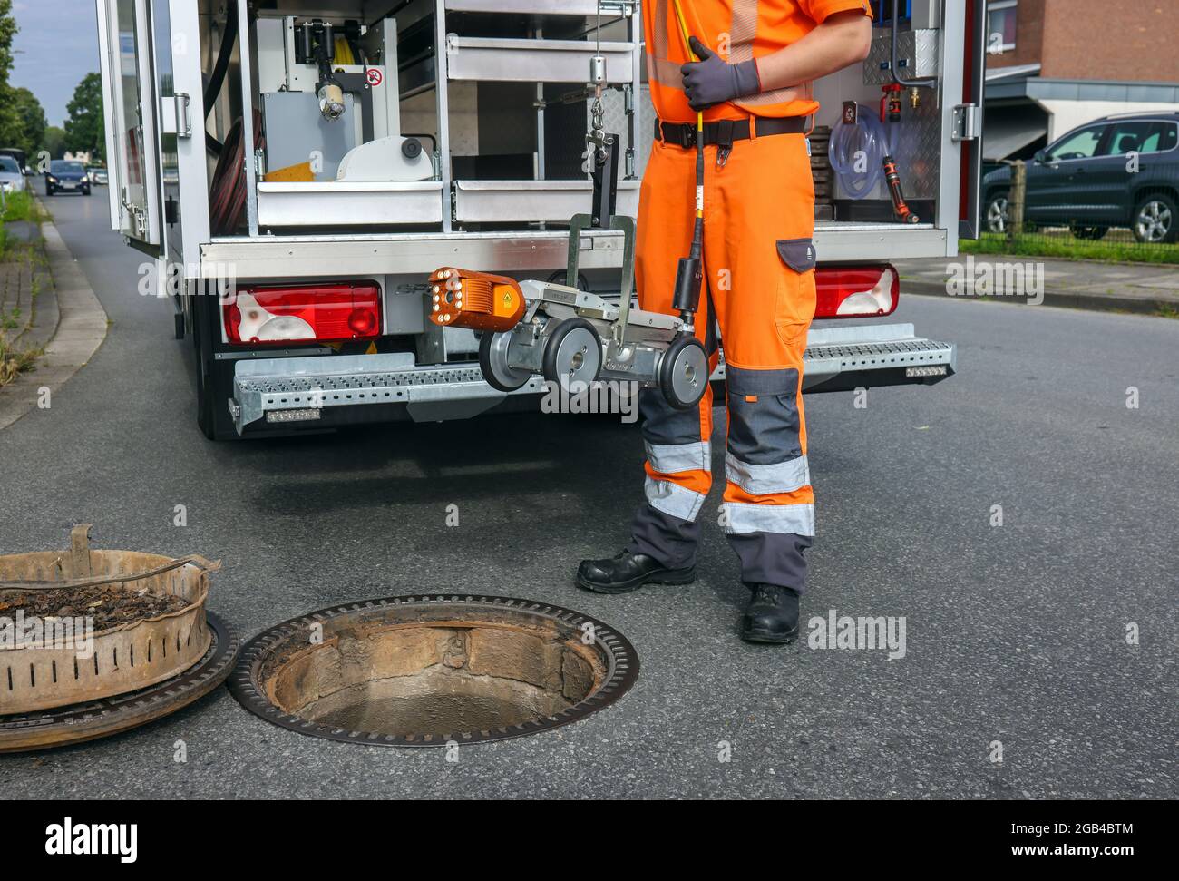 Hamm, North Rhine-Westphalia, Germany - TV sewer inspection vehicle, sewer inspection by camera, a trainee, a specialist for pipe, sewer and industria Stock Photo