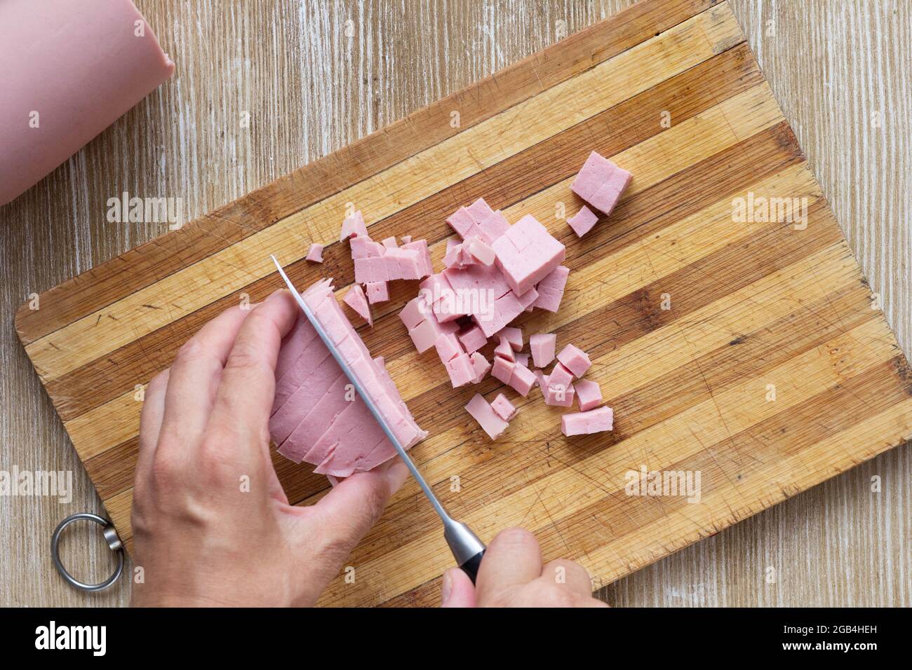 Woman cooking cutting sausage knife hi-res stock photography and images ...