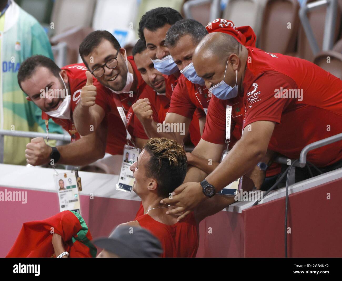 Tokyo, Japan. 02nd Aug, 2021. Morocco's coaches congratulate Soufiane El Bakkali (bottom) after winning the Men's 3000m Steeplechase Final with a time of 8:08.90 at Olympic Stadium during the 2020 Summer Olympics in Tokyo, Japan on Monday, August 2, 2021. Photo by Tasos Katopodis/UPI Credit: UPI/Alamy Live News Stock Photo