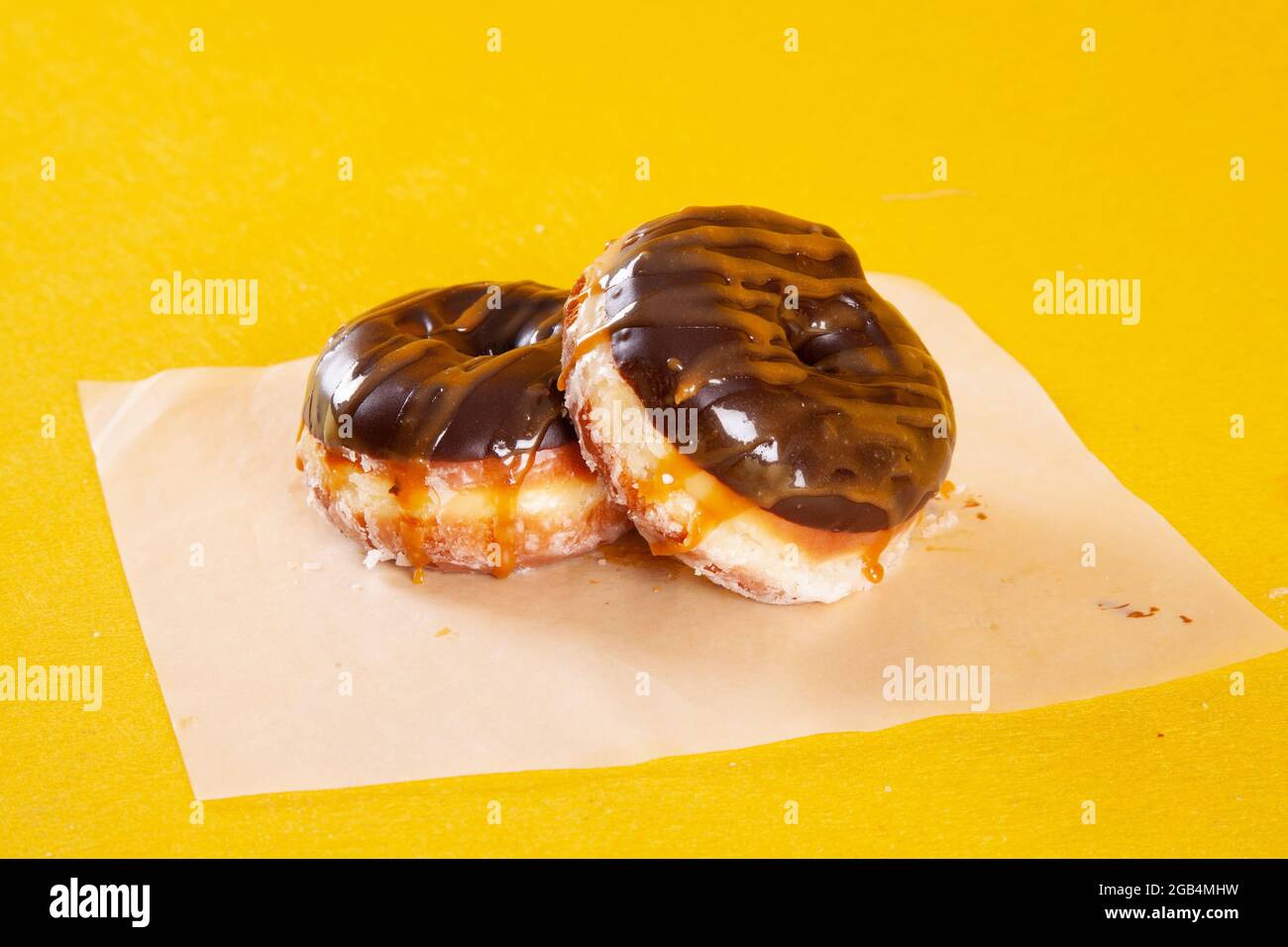 Chocolate caramel frosting brioche handmade gourmet doughnut Stock Photo