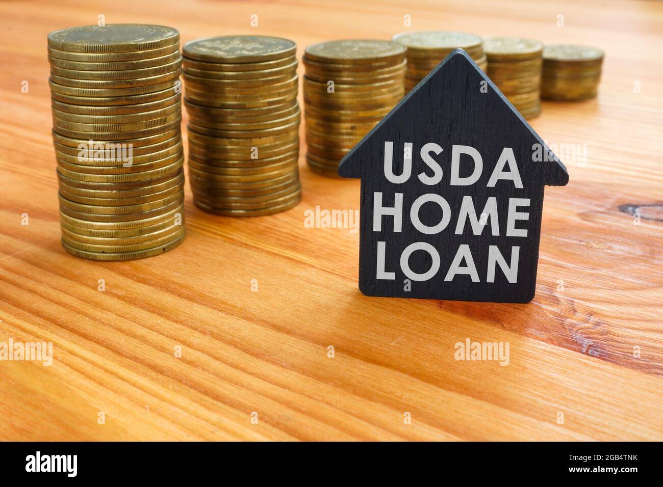 USDA home loan and pile of coins. Stock Photo