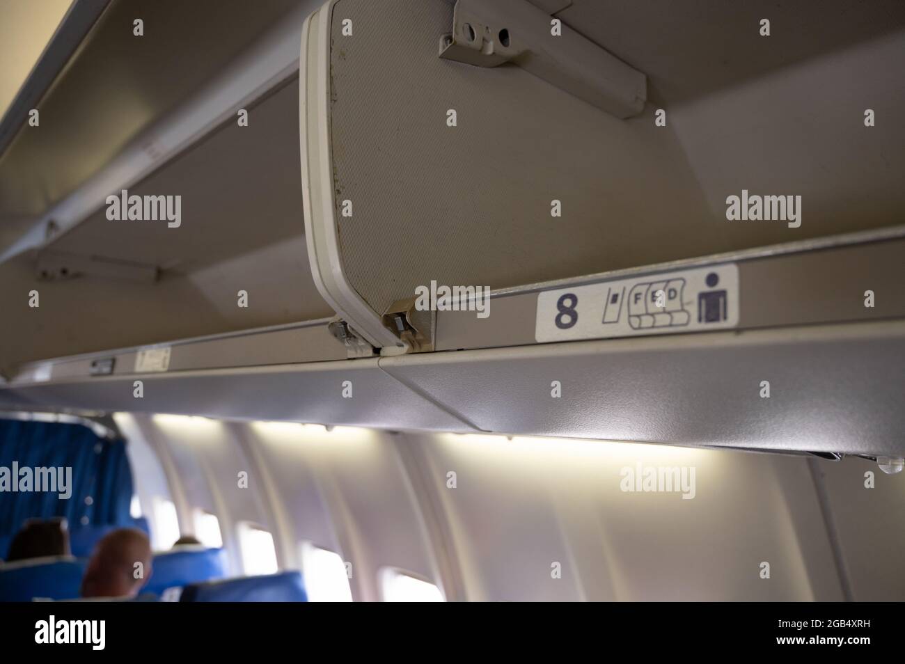 Luggage racks in an airplane Stock Photo Alamy