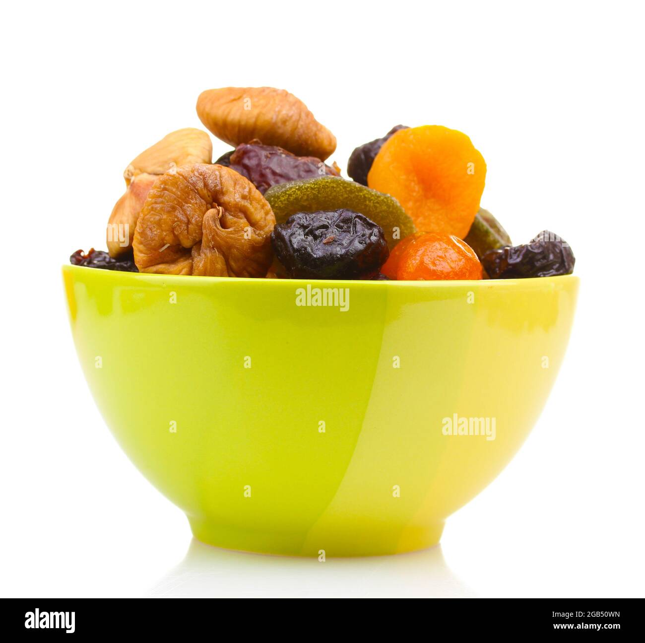 Dried fruits in green bowl isolated on white Stock Photo Alamy