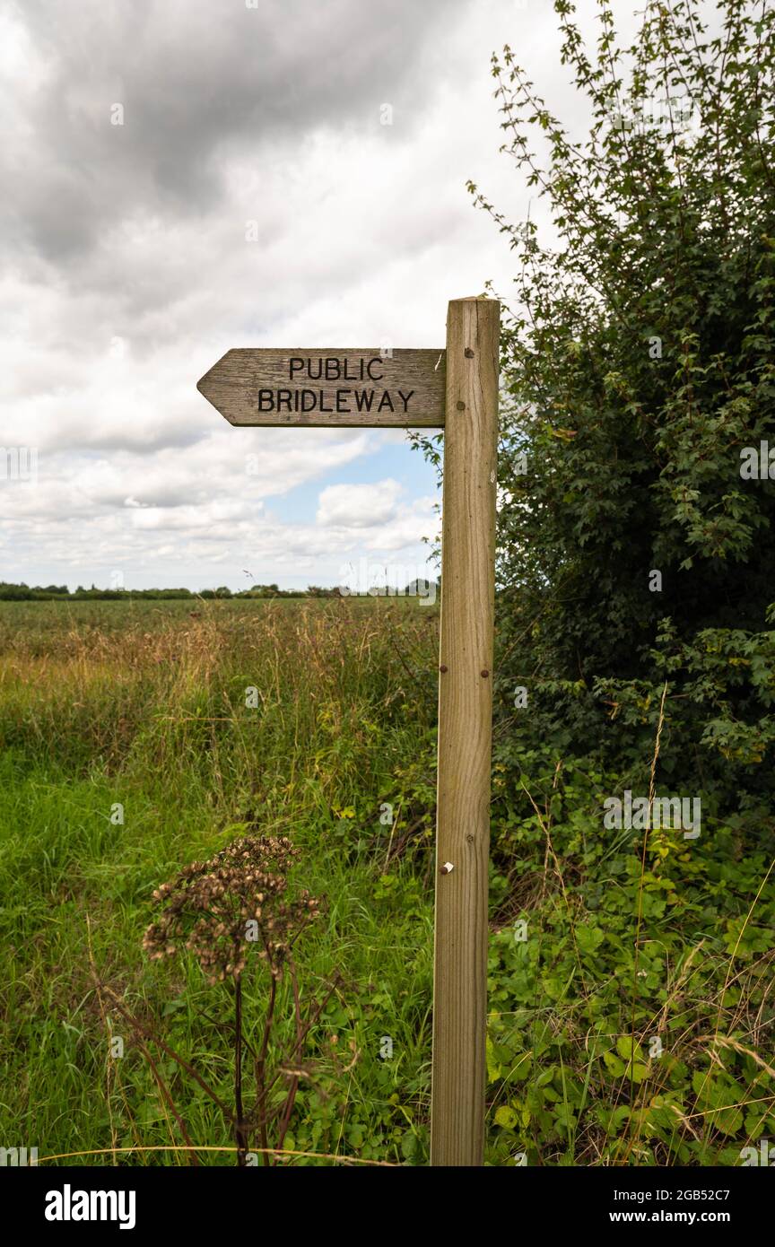 Wooden post with Public Bridleway path in Norfolk countryside Stock Photo