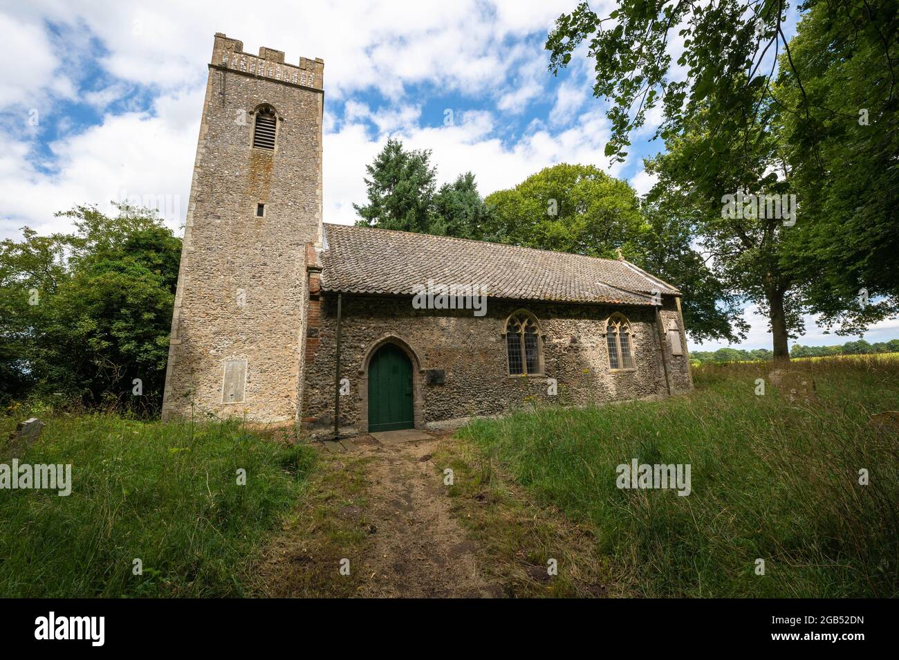 Great Witchingham Saint Marys church with an overgrown church yard Stock Photo