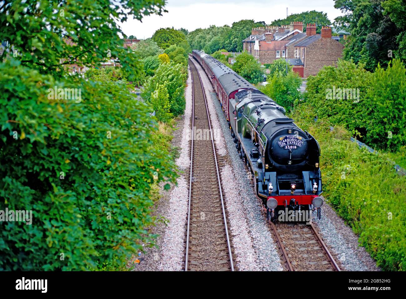 Merchant Navy Class no 35018 British India Line with the Scarborough Spa Express approaching Bootham in York, England Stock Photo