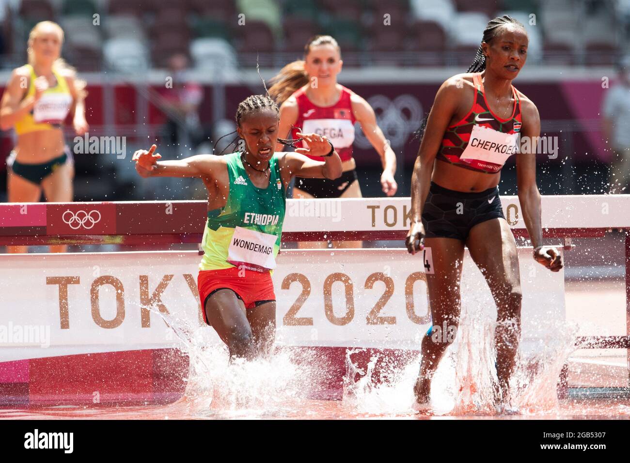 August 01, 2021: Beatrice Chepkoech (2752) of Kenya and Zerfe Wondemagegn (1856) of Ethiopia jump the barrier into the water pit in the 3000m Steeplechase during Athletics competition at Olympic Stadium in Tokyo, Japan. Daniel Lea/CSM} Stock Photo