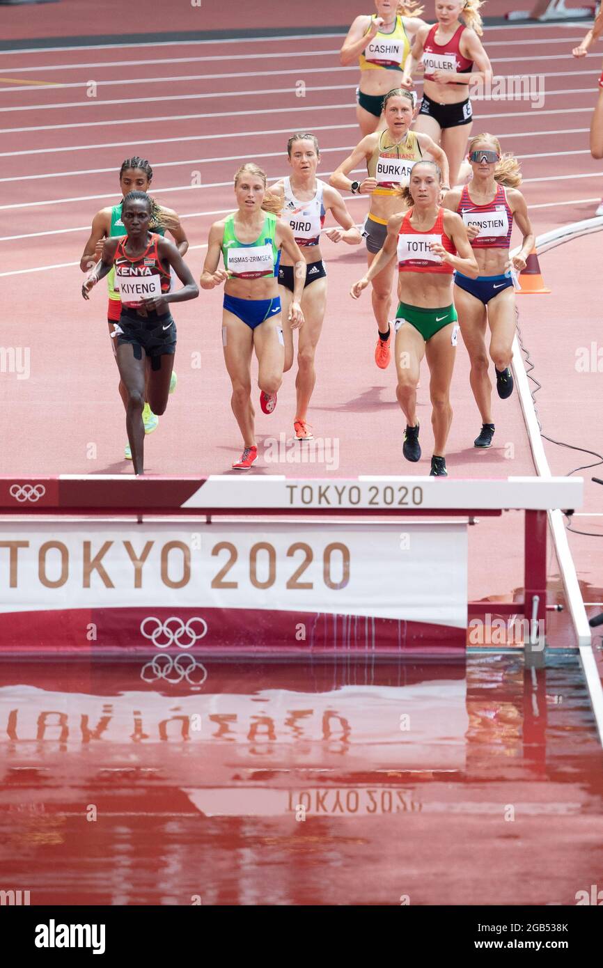 August 01, 2021 Runners in Heat 3 of the 3000m Steeplechase approach the barrier and water pit