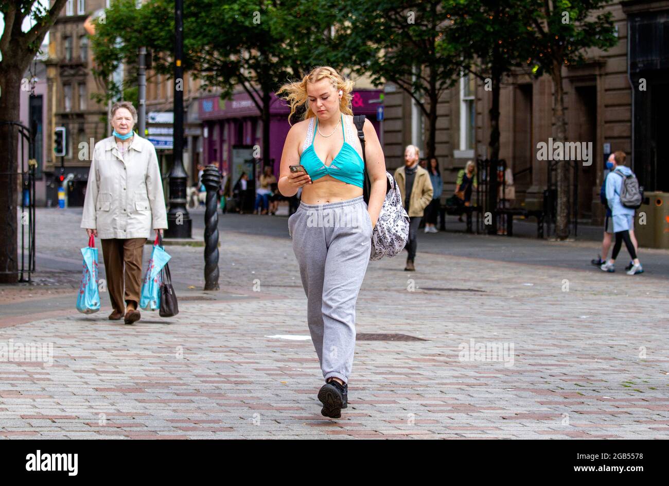Dundee, Tayside, Scotland, UK. 2nd Aug, 2021. UK Weather: A cool windy day with occasional sunny spells across North East Scotland with temperatures reaching 14°C. Bank Holiday Monday sees only a few people out in Dundee city centre socialising whilst shopping. Credit: Dundee Photographics/17�Թ����� Live News Stock Photo
