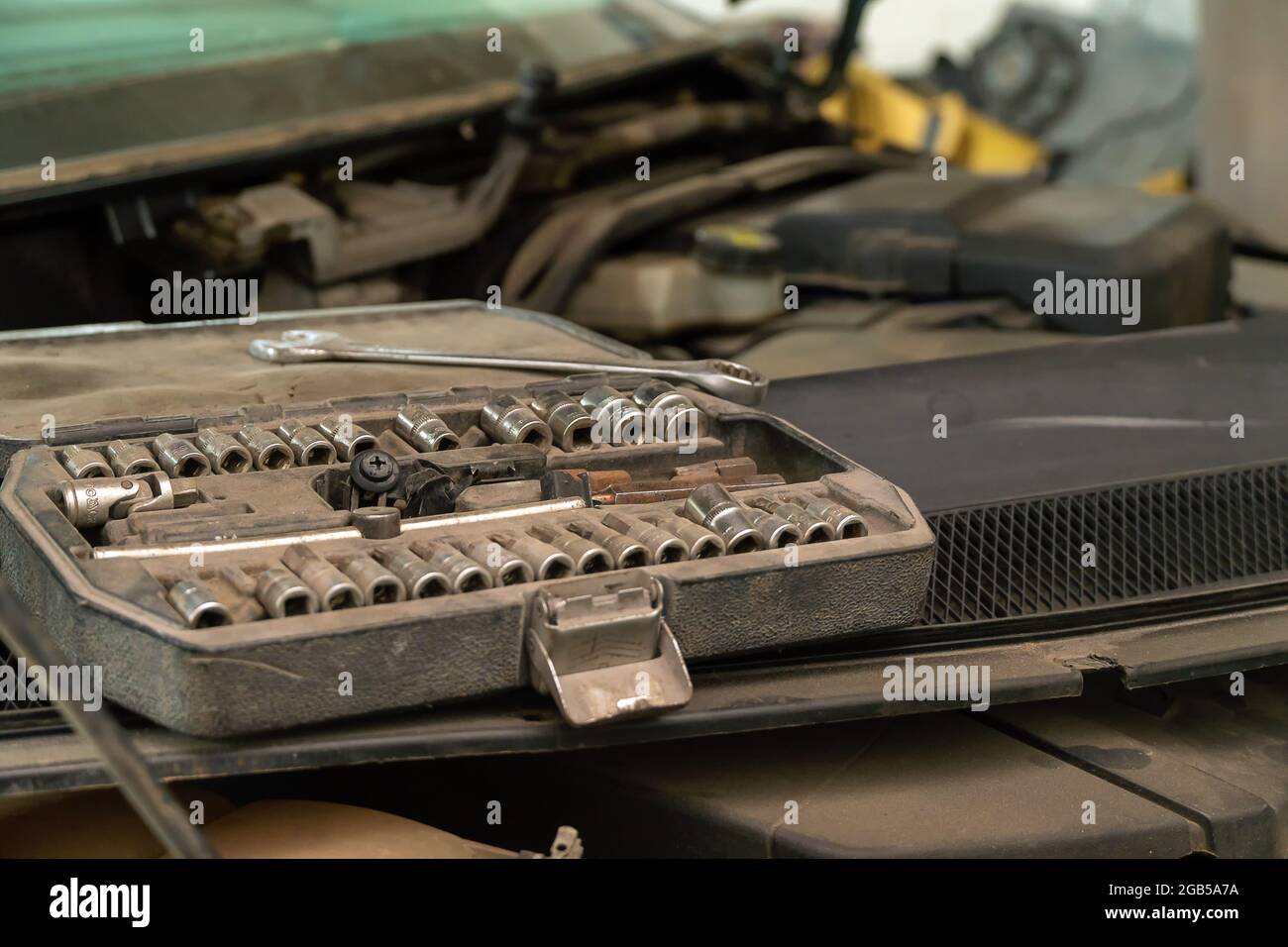 Old iron wrench heads in the tool box close-up copy space Stock Photo