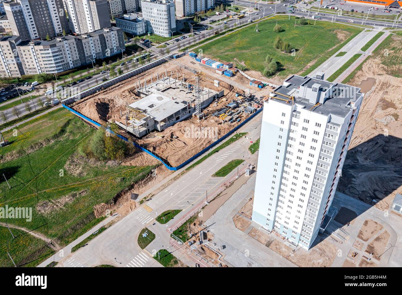 newly constructed high-rise apartment building in urban residential area. aerial view in sunny day. Stock Photo