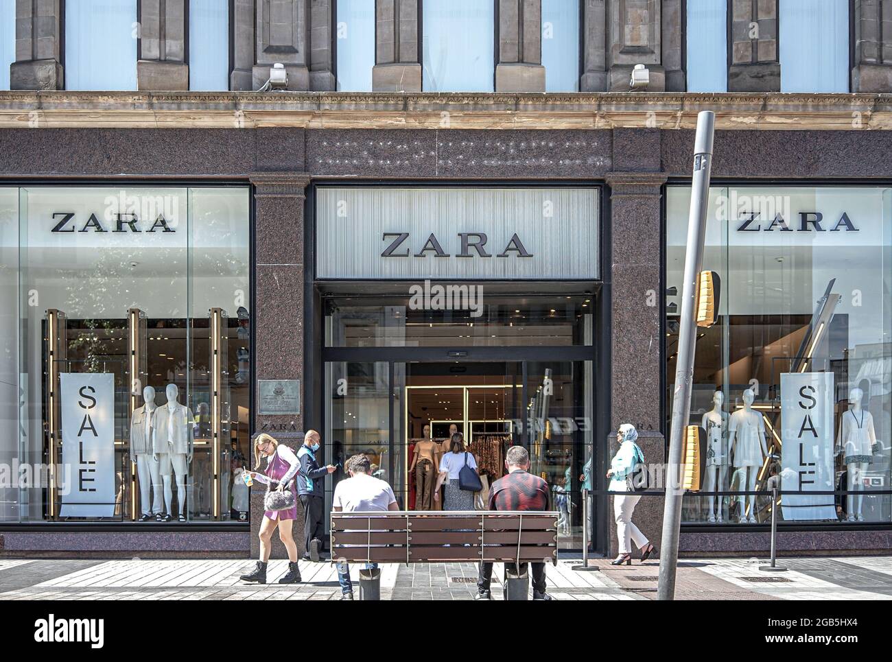 Masked customers queue to enter ZARA Fashion Store in Donegall Place,  Belfast Stock Photo - Alamy