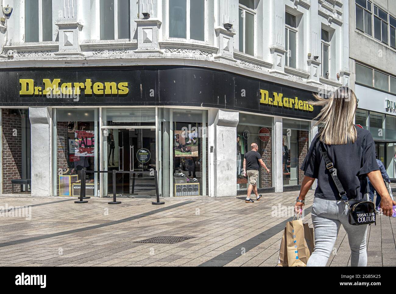 Shoppers walk past Dr. Martens Footwear Store on Corn Market in Belfast.  (Photo by Michael McNerney / SOPA Images/Sipa USA Stock Photo - Alamy