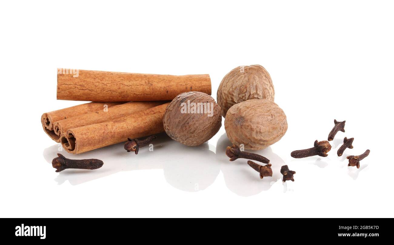 Cinnamon,nutmegs and carnation isolated on white Stock Photo Alamy