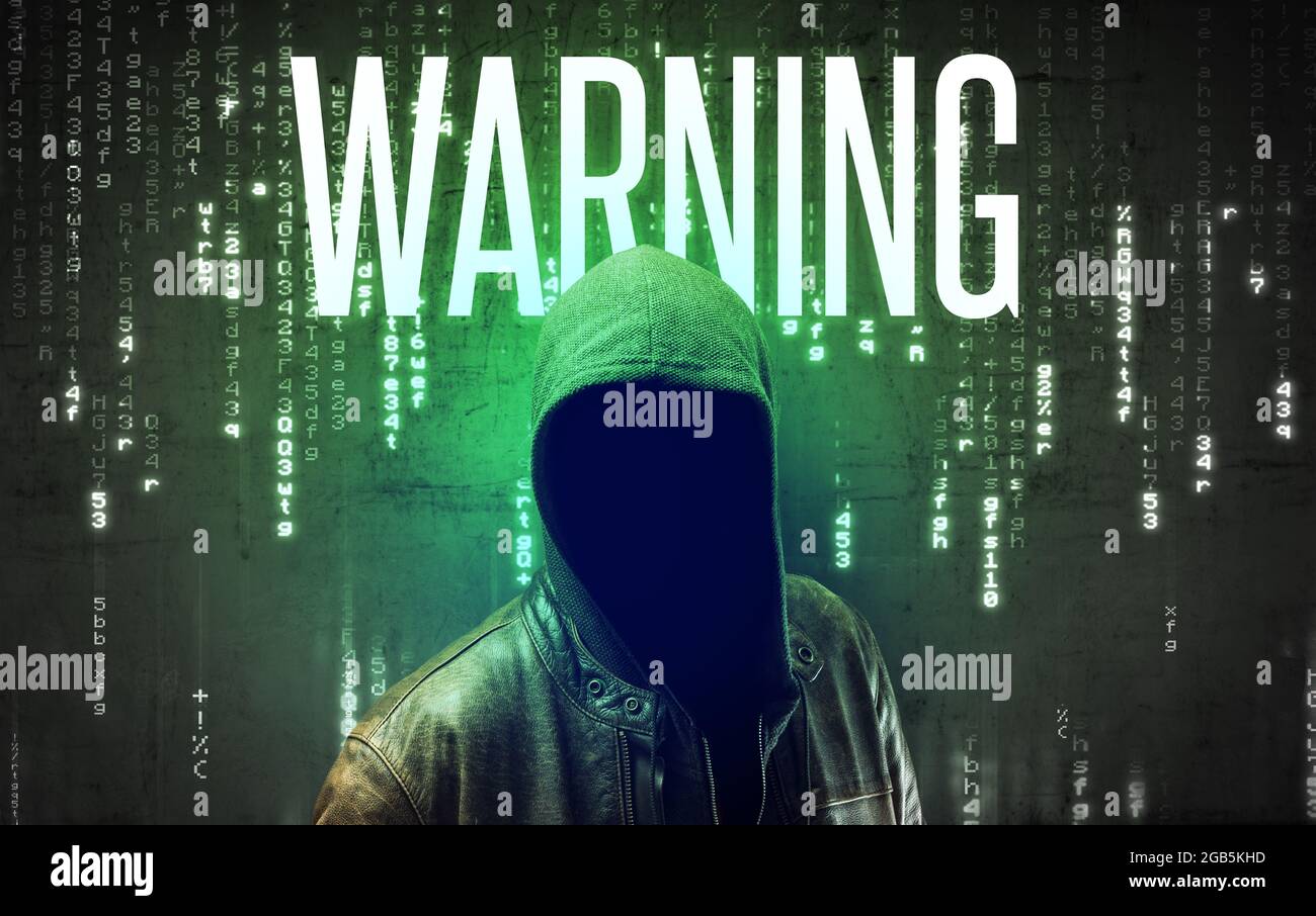 Faceless hacker with inscription Stock Photo